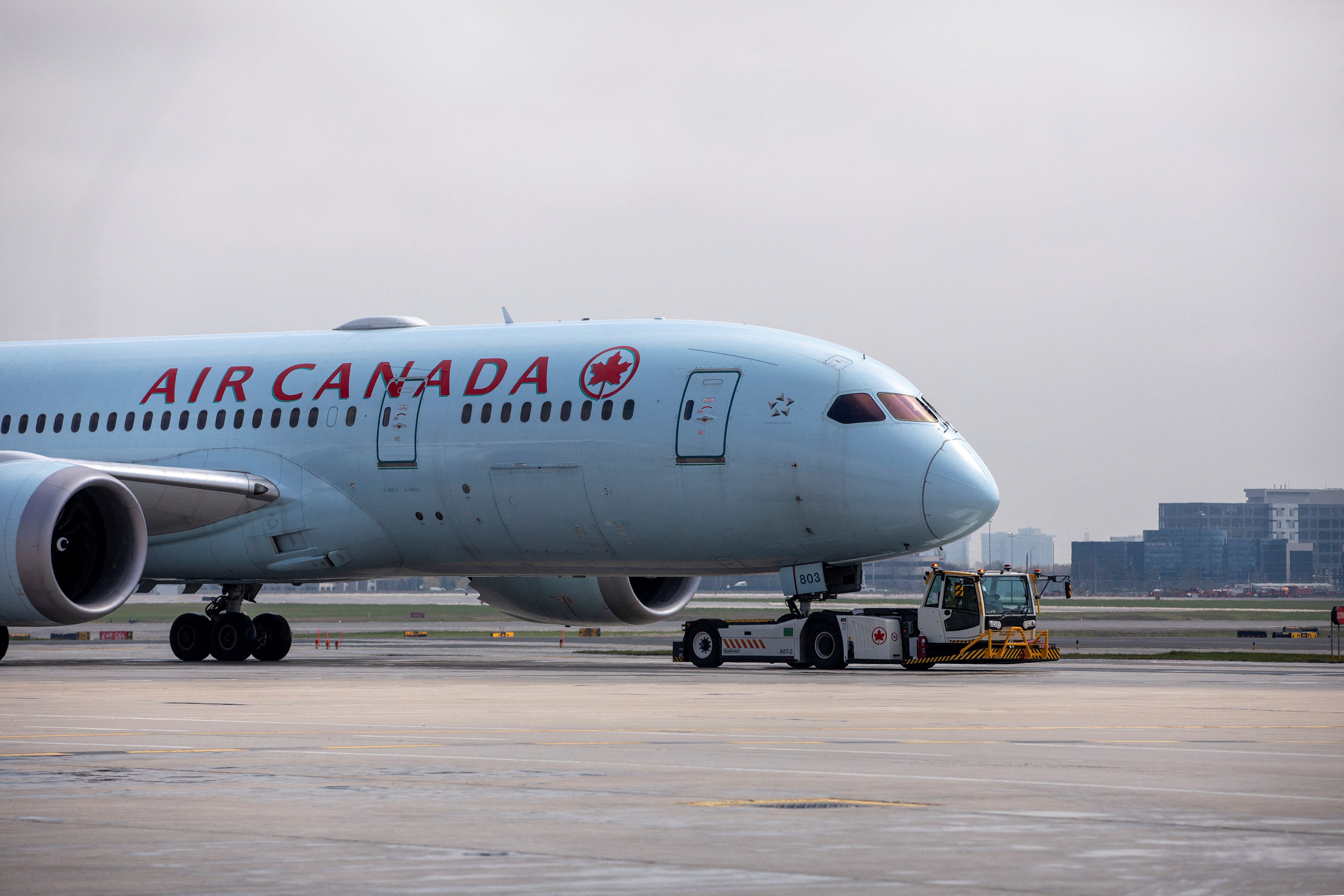 An Air Canada airplane is towed along a runway at Toronto Pearson Airport in Mississauga, Ontario, Canada April 28, 2021.