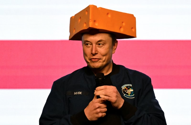 Elon Musk wears a cheese hat as he holds a rally in support of a Wisconsin state Supreme Court candidate in April.