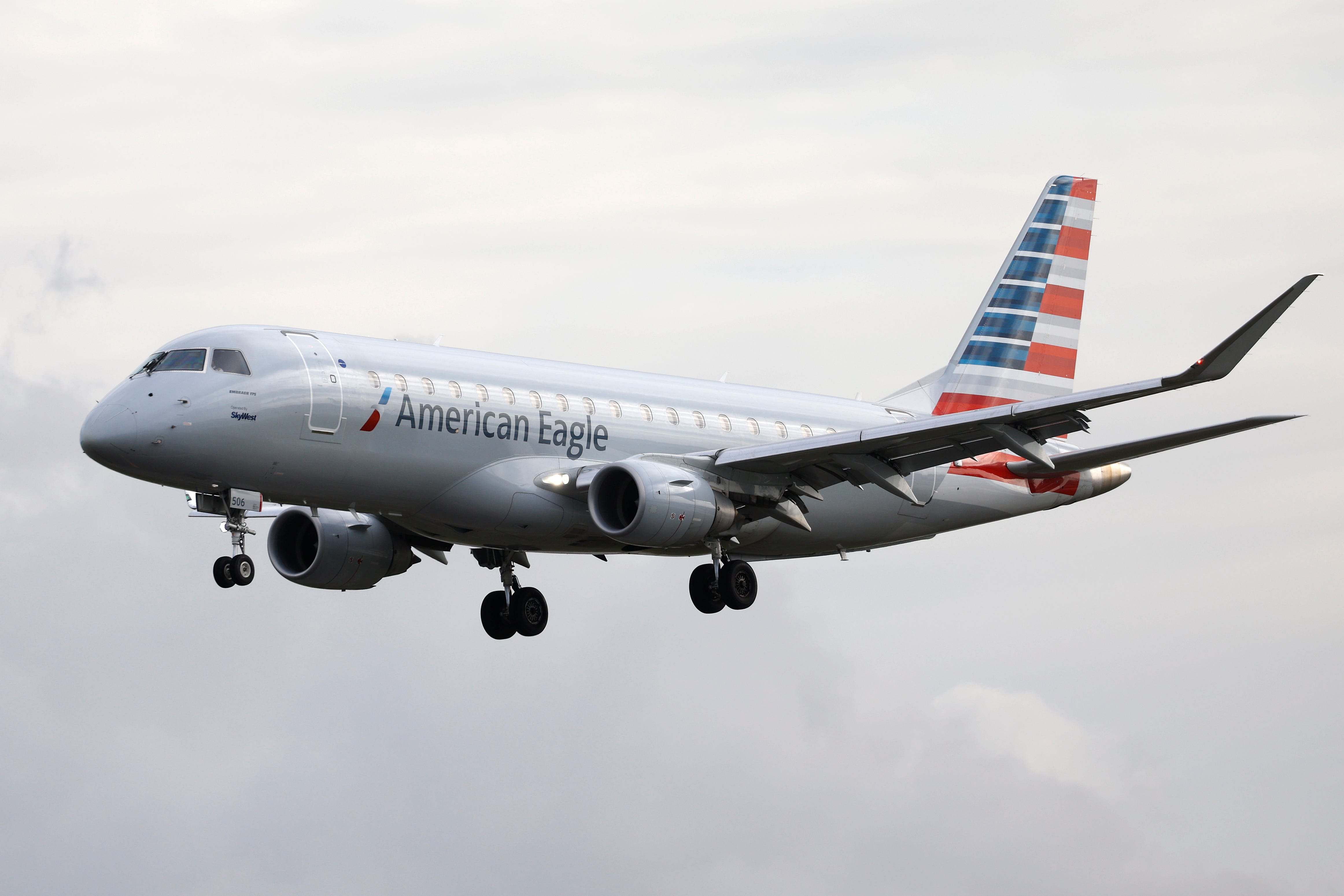 An American Eagle, operated by SkyWest Airlines, Embraer E175LR airplane arrives at Los Angeles International Airport from Tucson on March 30, 2025