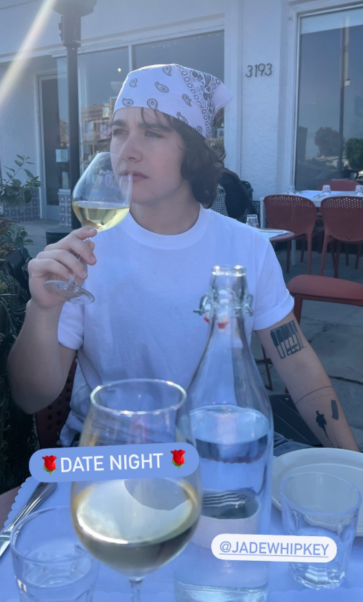 Jade Whipkey with a glass a wine at sunset. 