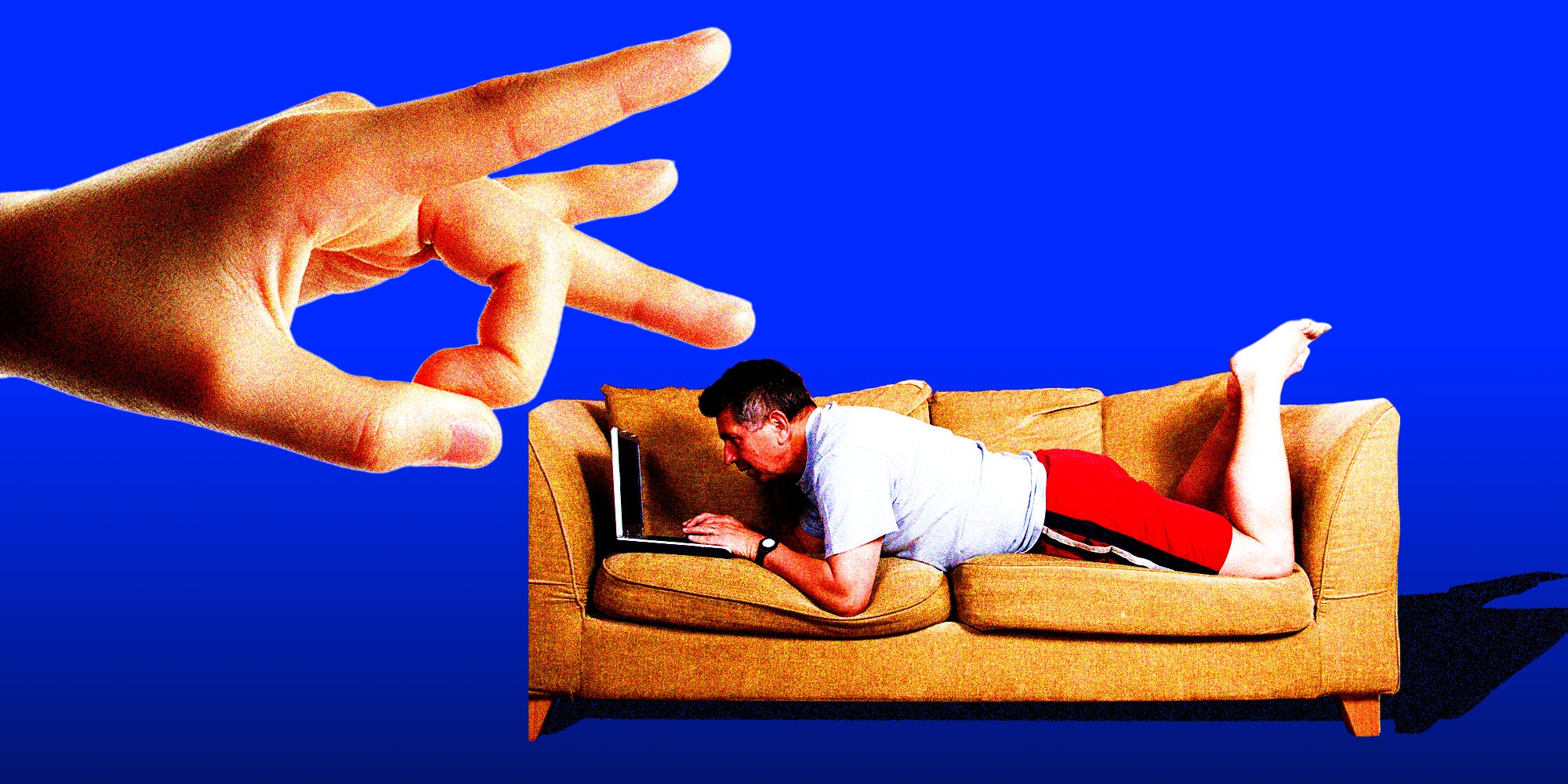 Finger flicking a person working on a computer laying on a couch