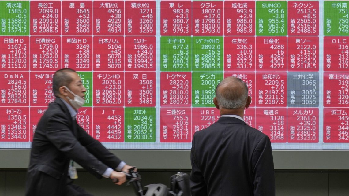 Asian shares mostly lower, trading in a narrow range with US markets closed for Memorial Day