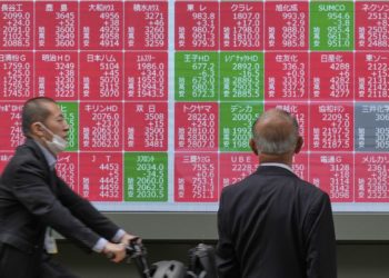 Asian shares mostly lower, trading in a narrow range with US markets closed for Memorial Day