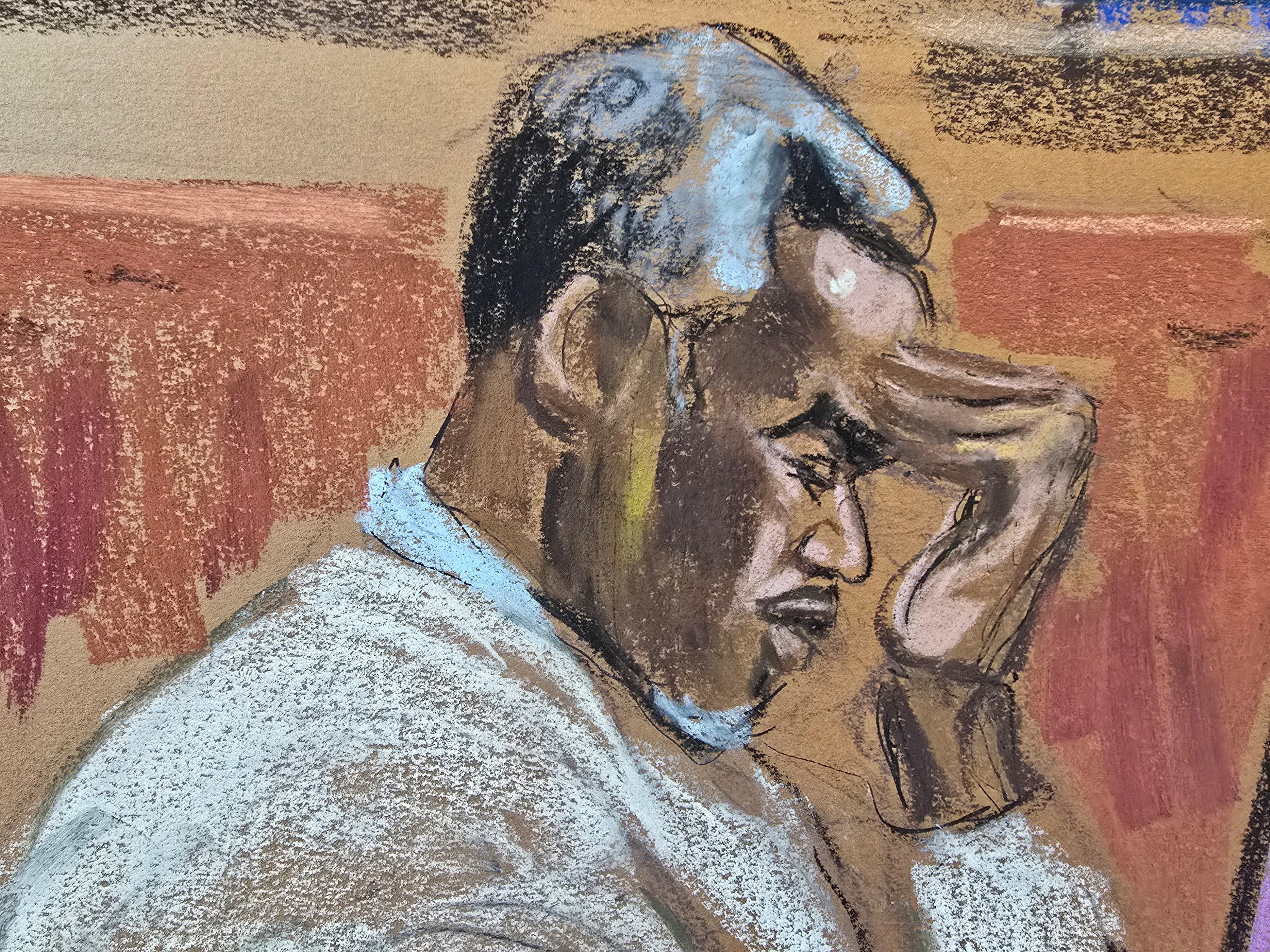 A court sketch shows Sean "Diddy" Combs holding his hand to his head at his federal sex-trafficking and racketeering trial in Manhattan as one of his former personal assistants testifies against him.