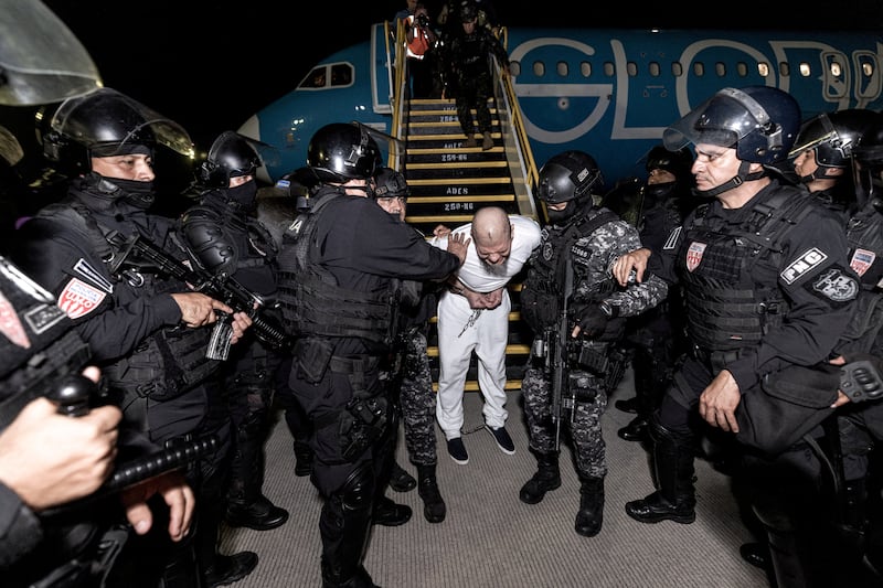 Salvadoran police escort alleged members of the Tren de Aragua gang who were deported from the U.S. in March. Many of those accused of being gang members claim they have no ties to Tren de Aragua.