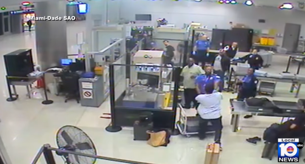 Cameron Dylan McDougall attacks a Miami International Airport TSA agent at a security screening area on Dec. 28, 2024.