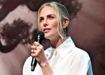 Charlize Theron Appears At Netflix Upfront Following Injury On Set Of ‘Apex’: “My Cute Boot Is Hiding A Fractured Toe”