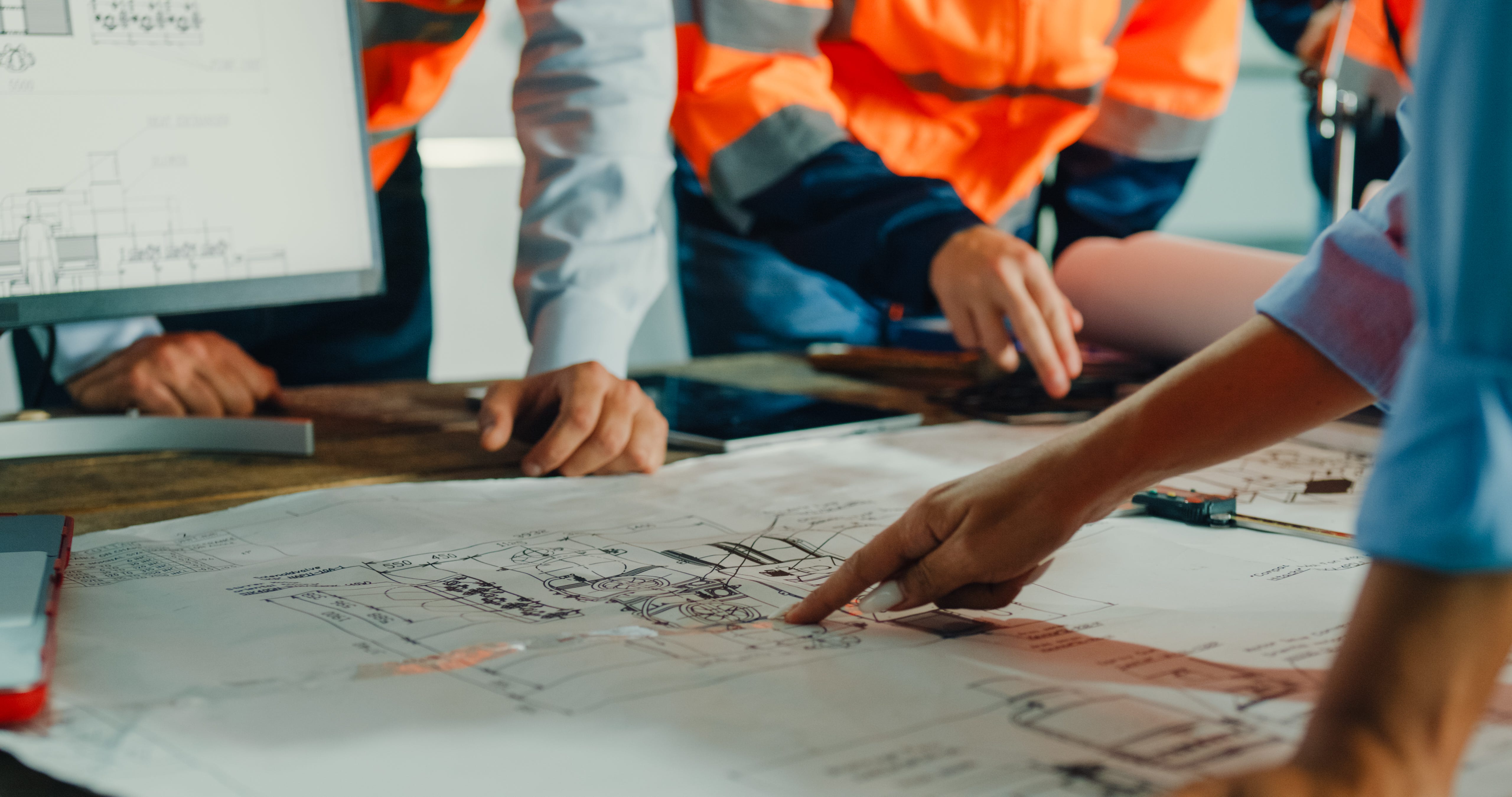 Workers looking at plan