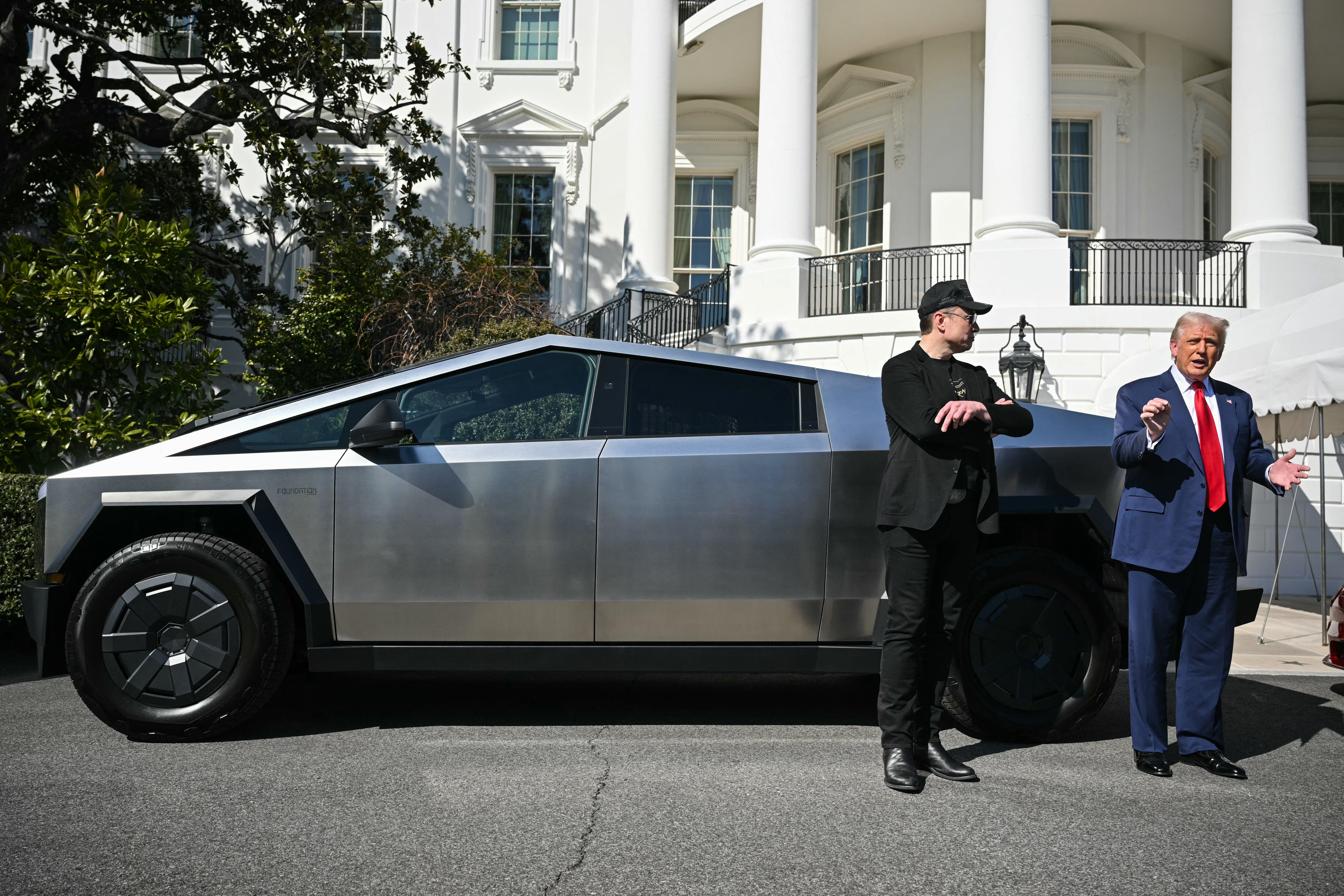 Trump and Elon Musk next to Cybertruck