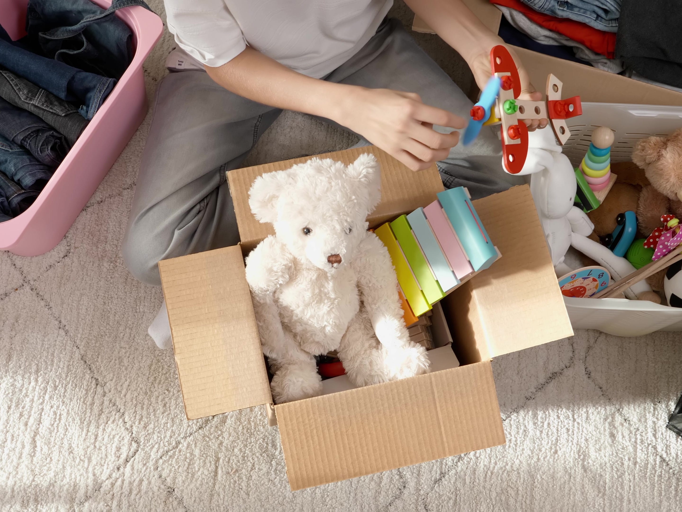 A person sorts through items to be donated or sold.