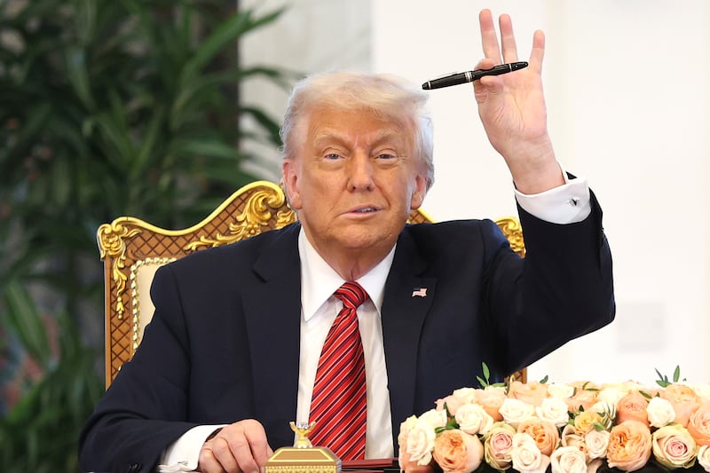 DOHA, QATAR - MAY 14: U.S. President Donald J. Trump attends a signing ceremony at the Amiri Diwan, the official workplace of the emir, on May 14, 2025, in Doha, Qatar. The visit underscores the strategic partnership between the United States and Qatar, focusing on regional security and economic collaboration. (Photo by Win McNamee/Getty Images)