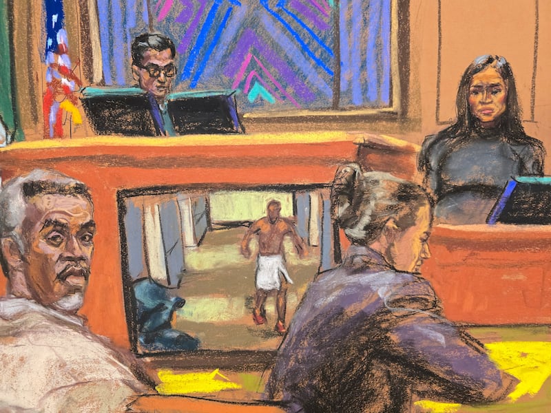 Sean "Diddy" Combs listens as his former girlfriend Casandra "Cassie" Ventura testifies as a video from a hotel is played at his sex trafficking trial.