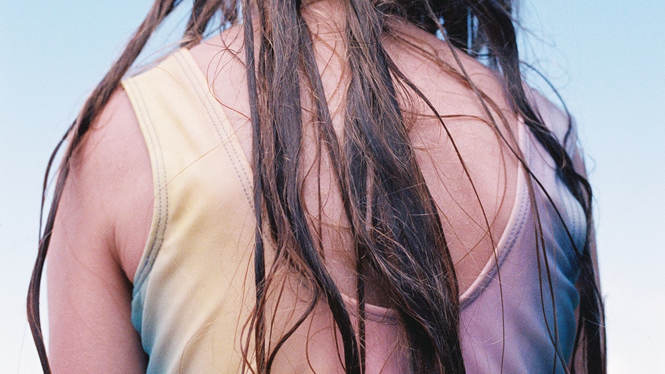 girl in bathing suit and damp hair