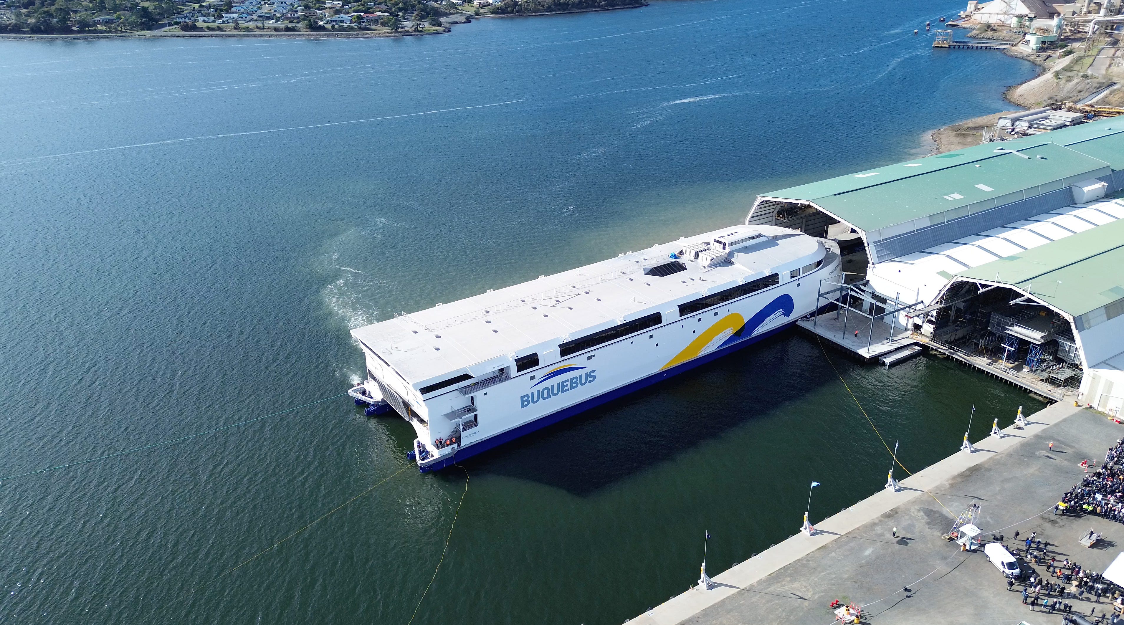 An aerial view of the Hull 096 ship at a port.