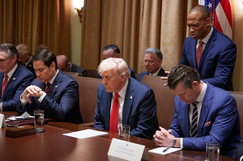 Secretary of Housing and Urban Development Scott Turner, Secretary of State Marco Rubio, President Donald Trump, and Defense Secretary Pete Hegseth pray during a Cabinet meeting at the White House on February 26.