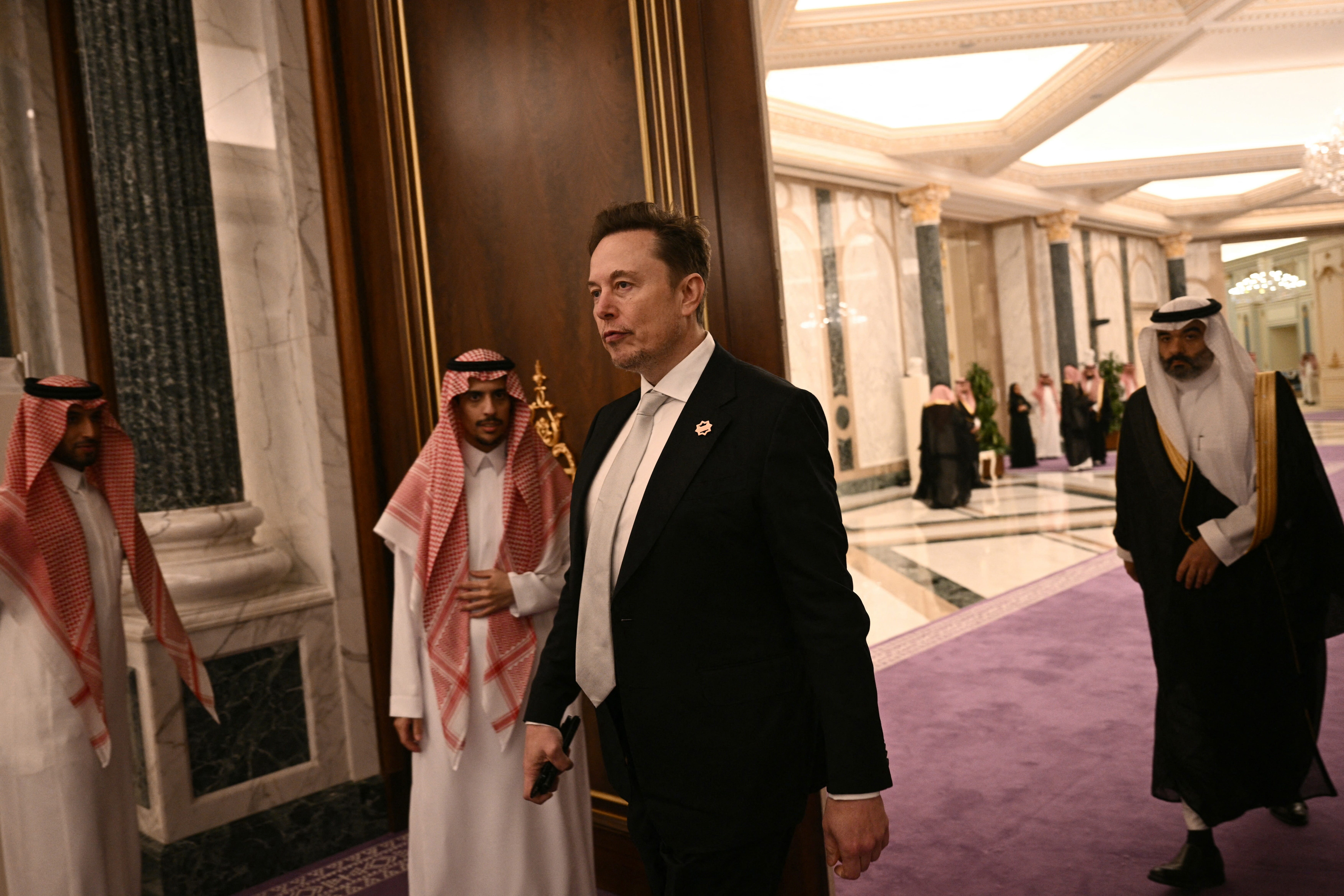 Elon Musk in a dark suit