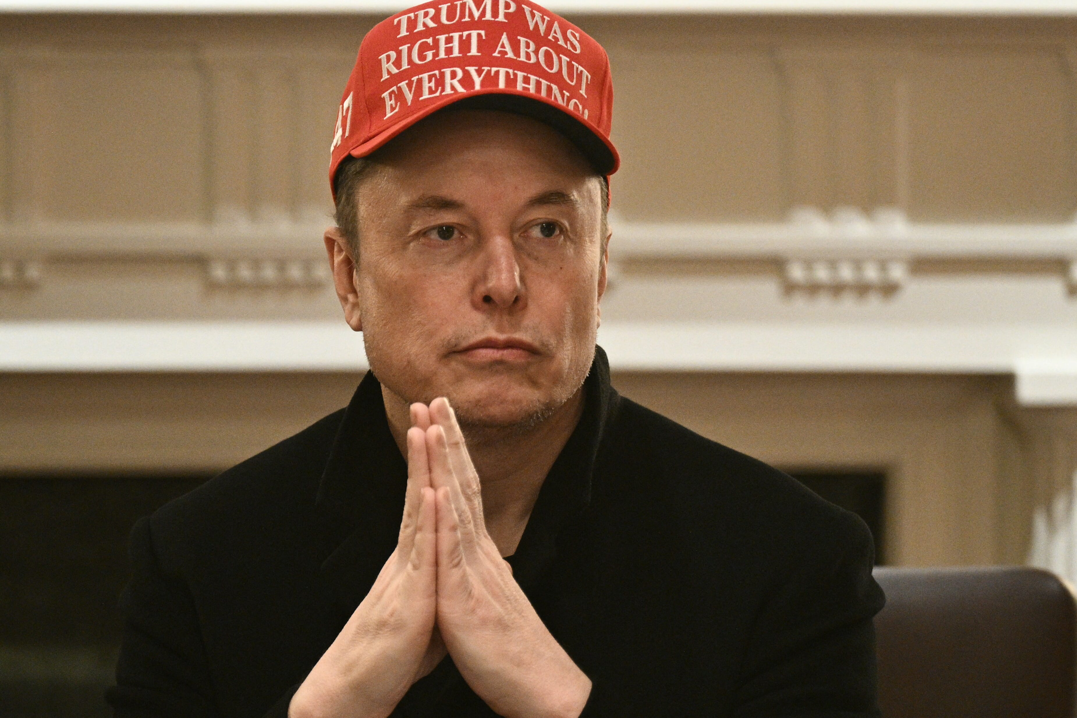Elon Musk sitting in the cabinet room in the White House.