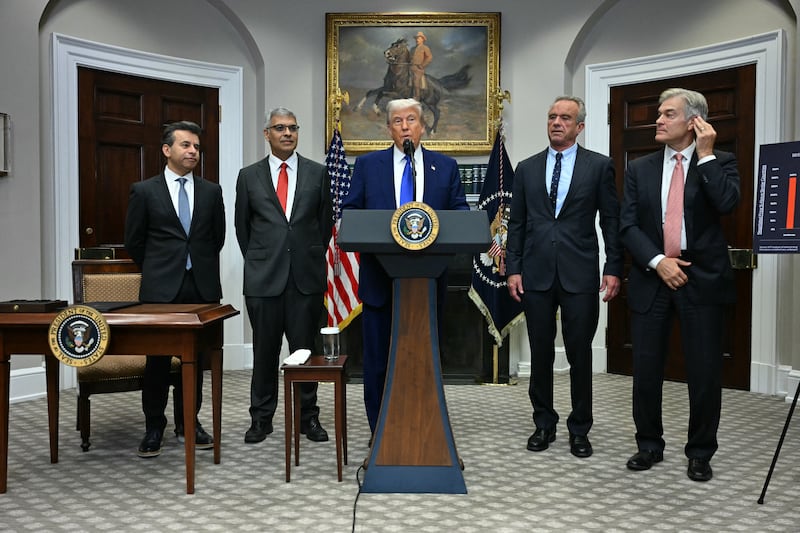 President Donald Trump (C), alongside (L-R) FDA Commissioner Marty Makary, National Institute of Health (NIH) Director Jayanta Bhattacharya, Secretary of Health and Human Services Robert F. Kennedy Jr and Administrator for the Centers for Medicare and Medicaid Services Mehmet Oz, speaks during a news conference about prescription drug prices, in the Roosevelt Room of the White House on May 12, 2025, in Washington, DC.