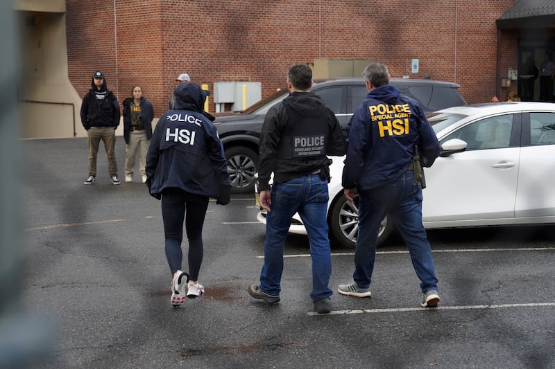 Homeland Security Investigations (HSI) and Department of Homeland Security (DHS) agents watch a protest by supporters of Ras Baraka, mayor of Newark and New Jersey Democratic candidate for governor, outside the HSI Newark field office following Baraka?s arrest outside a U.S. immigration detention center, in Newark, New Jersey, U.S., May 9, 2025.  REUTERS/Bing Guan