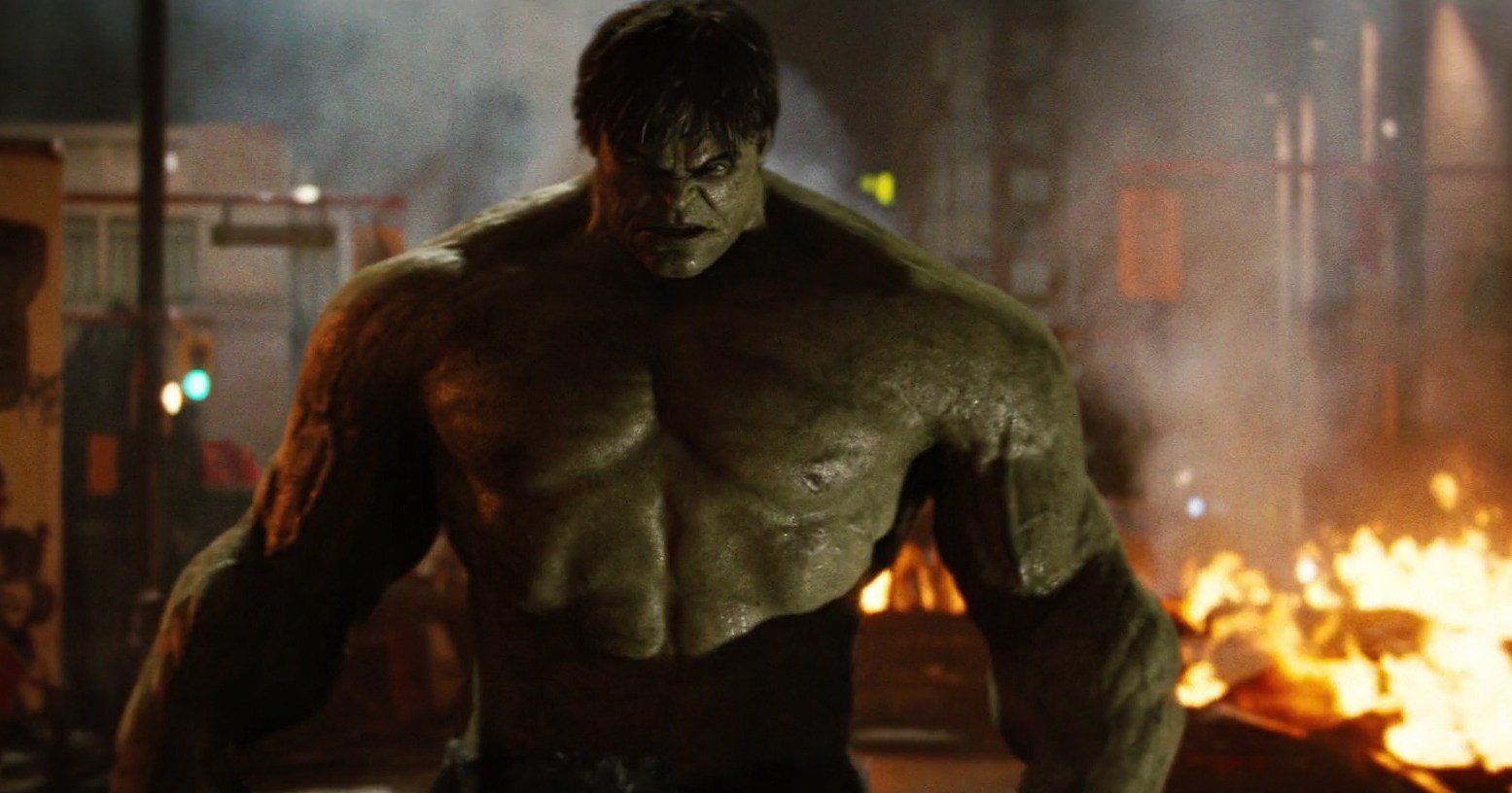 The Hulk, visibly very angry, on a burning street in The Incredible Hulk (2008).