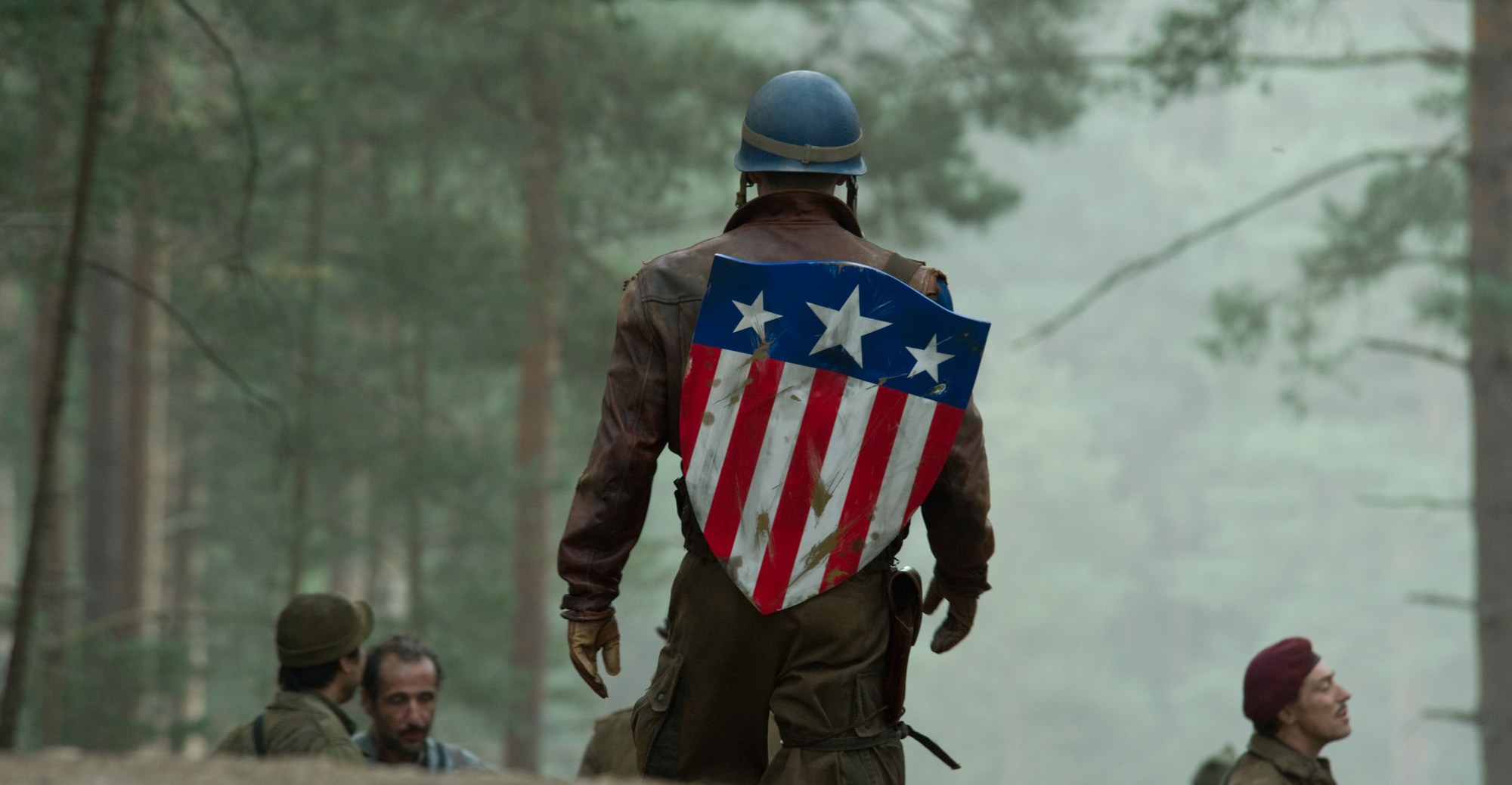 Steve Rodgers walks away from the camera, with his shield on his back