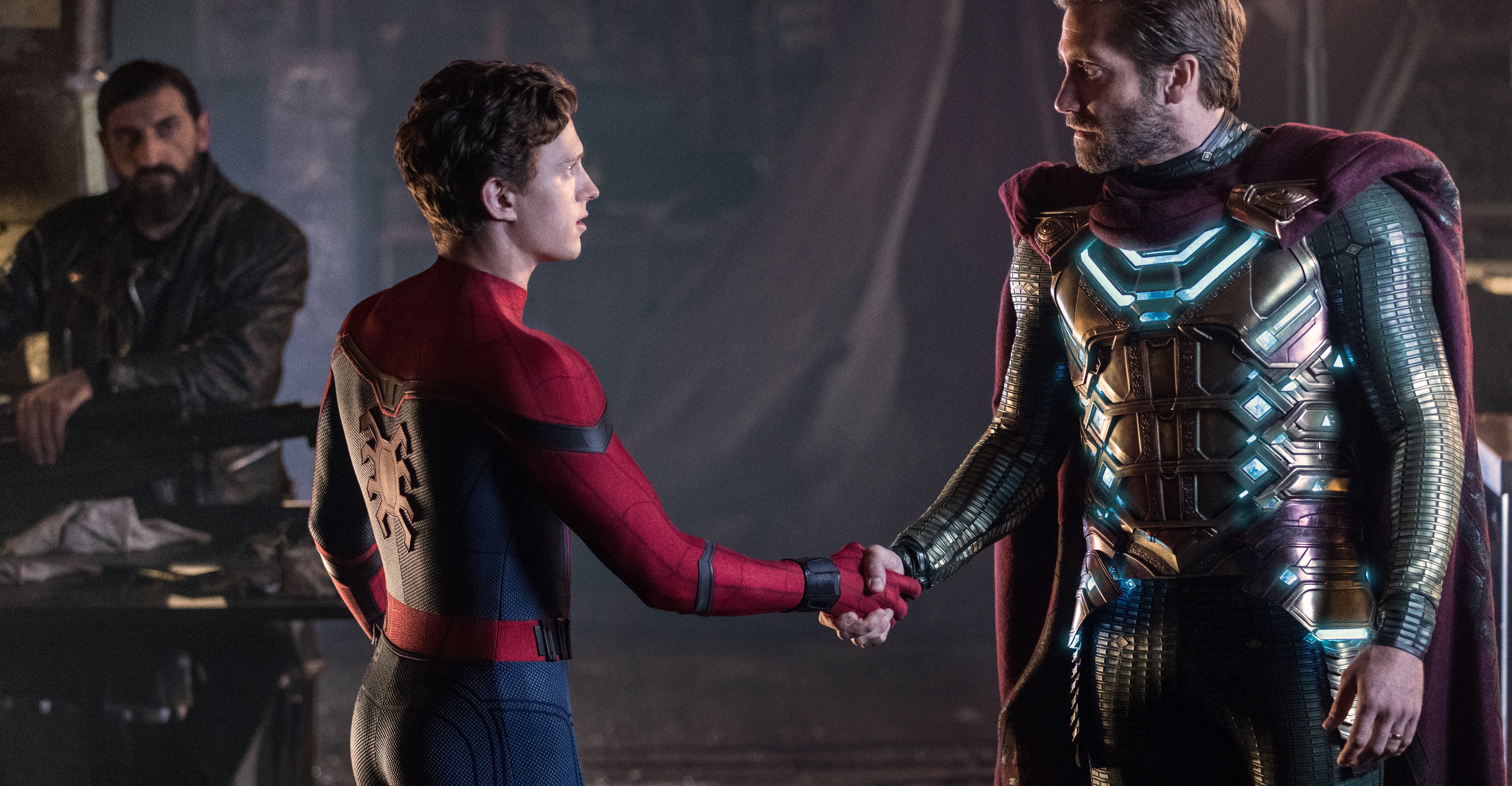 Tom Holland and Jake Gyllenhaal shake hands as Spider-Man and Mysterio in Spider-Man: Far From Home