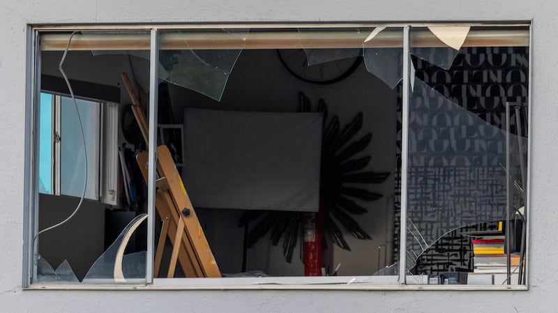 A window, about a block away, is left shattered by a bomb blast near the American Reproductive Centers fertility clinic on May 17, 2025 in Palm Springs, California