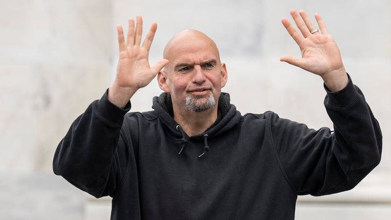 WASHINGTON, DC - APRIL 17: U.S. Sen. John Fetterman (D-PA) waves to reporters as he arrives at the U.S. Capitol on April 17, 2023 in Washington, DC. Fetterman is returning to the Senate following six weeks of treatment for clinical depression. (Photo by Drew Angerer/Getty Images)