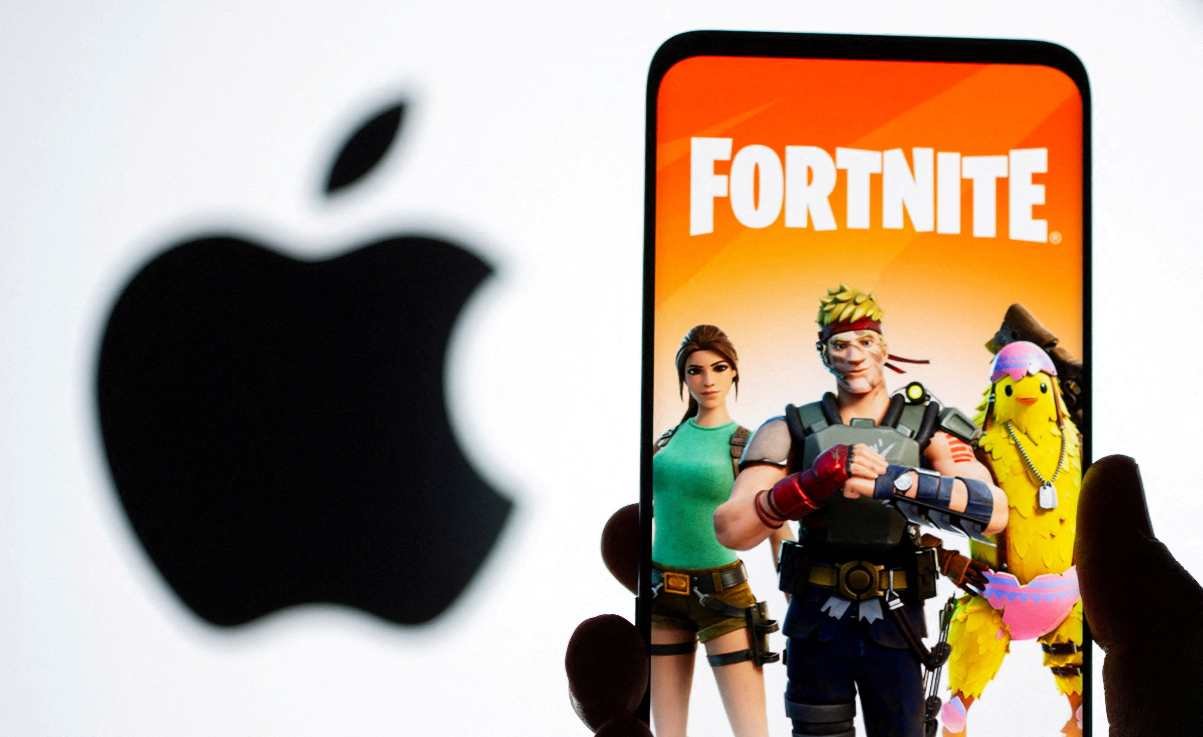 Fortnite on a phone in front of an Apple logo