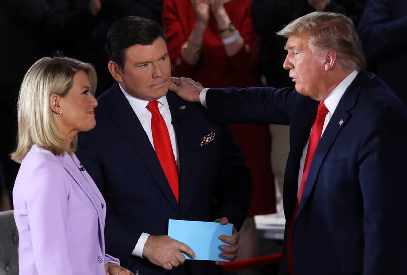 Donald Trump speaks to Fox News moderators Bret Baier and Martha MacCallum after a town hall in 2020.