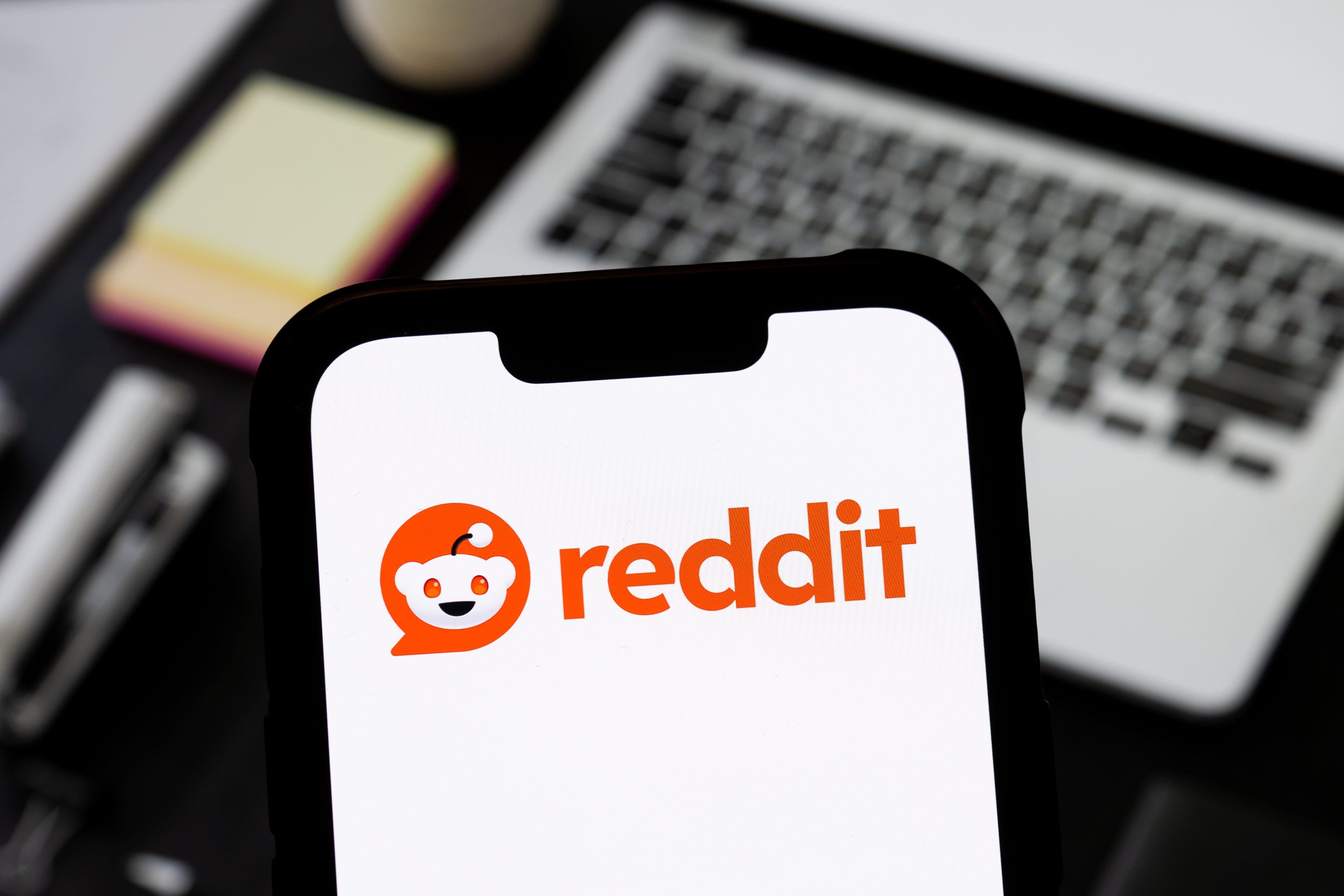 Reddit logo displayed on a phone