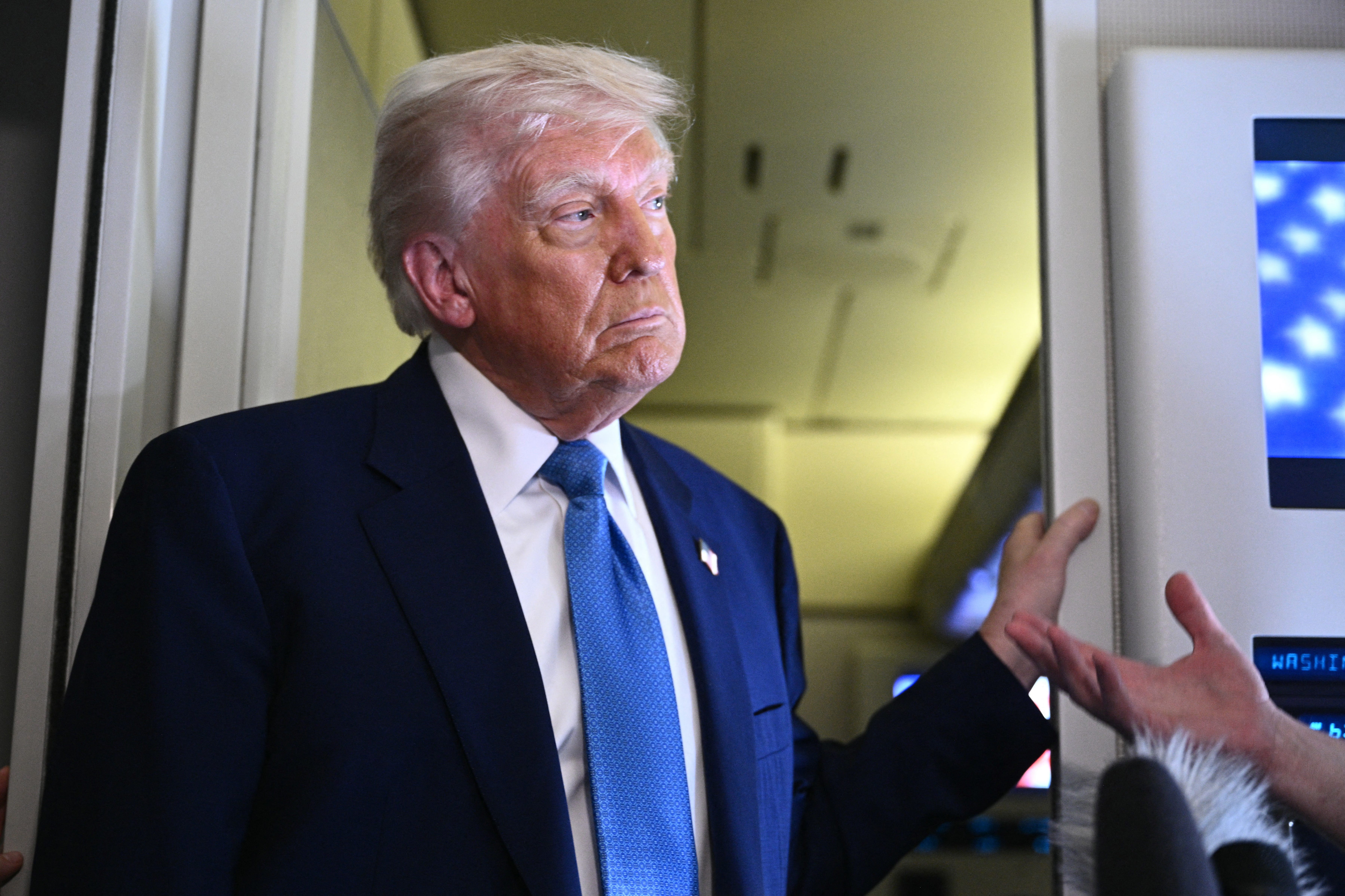 Donald Trump speaks to reporters during his Middle East trip, May 16 2025
