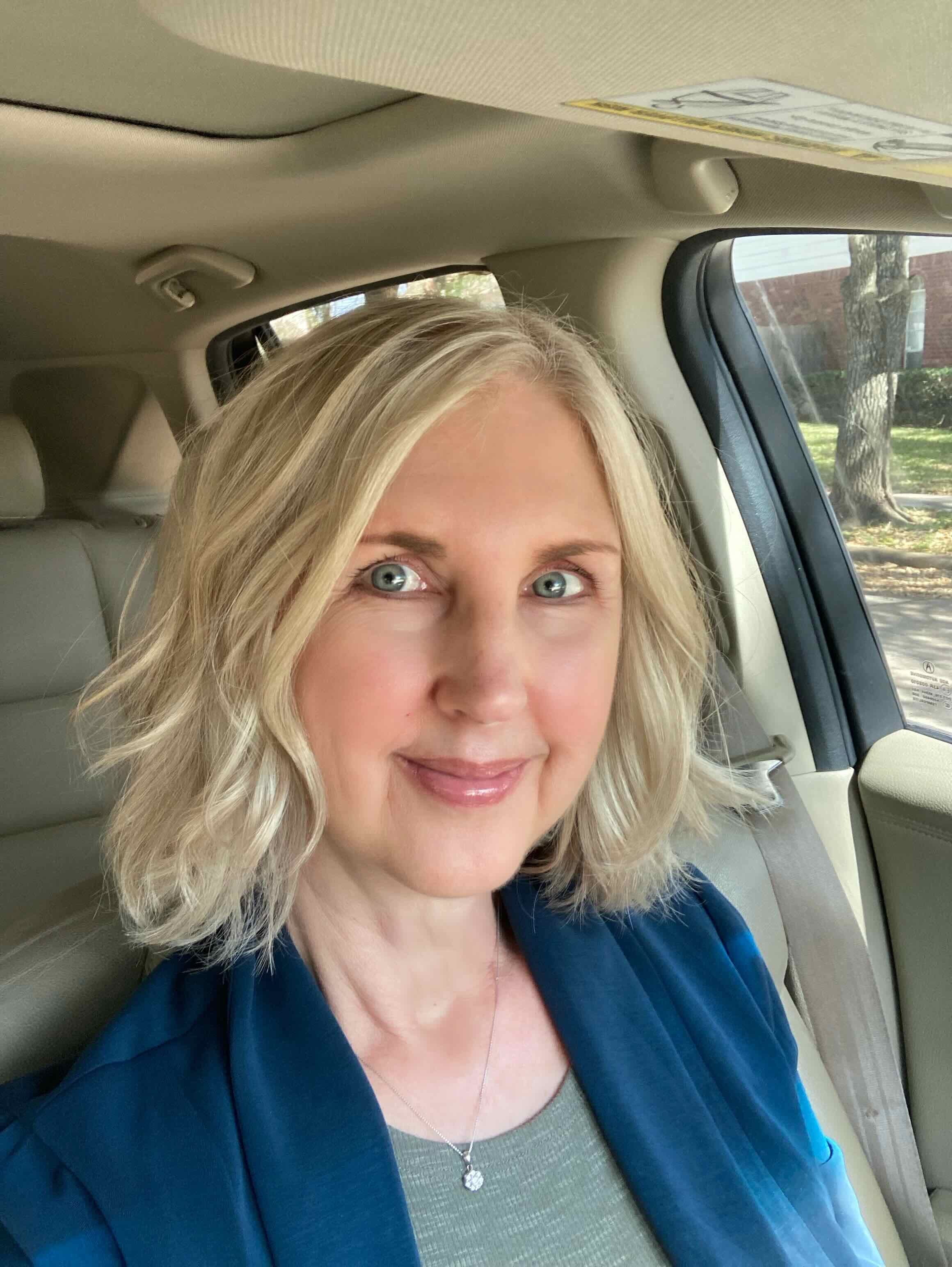 Courtenay Rudzinski in a car smiling at the camera