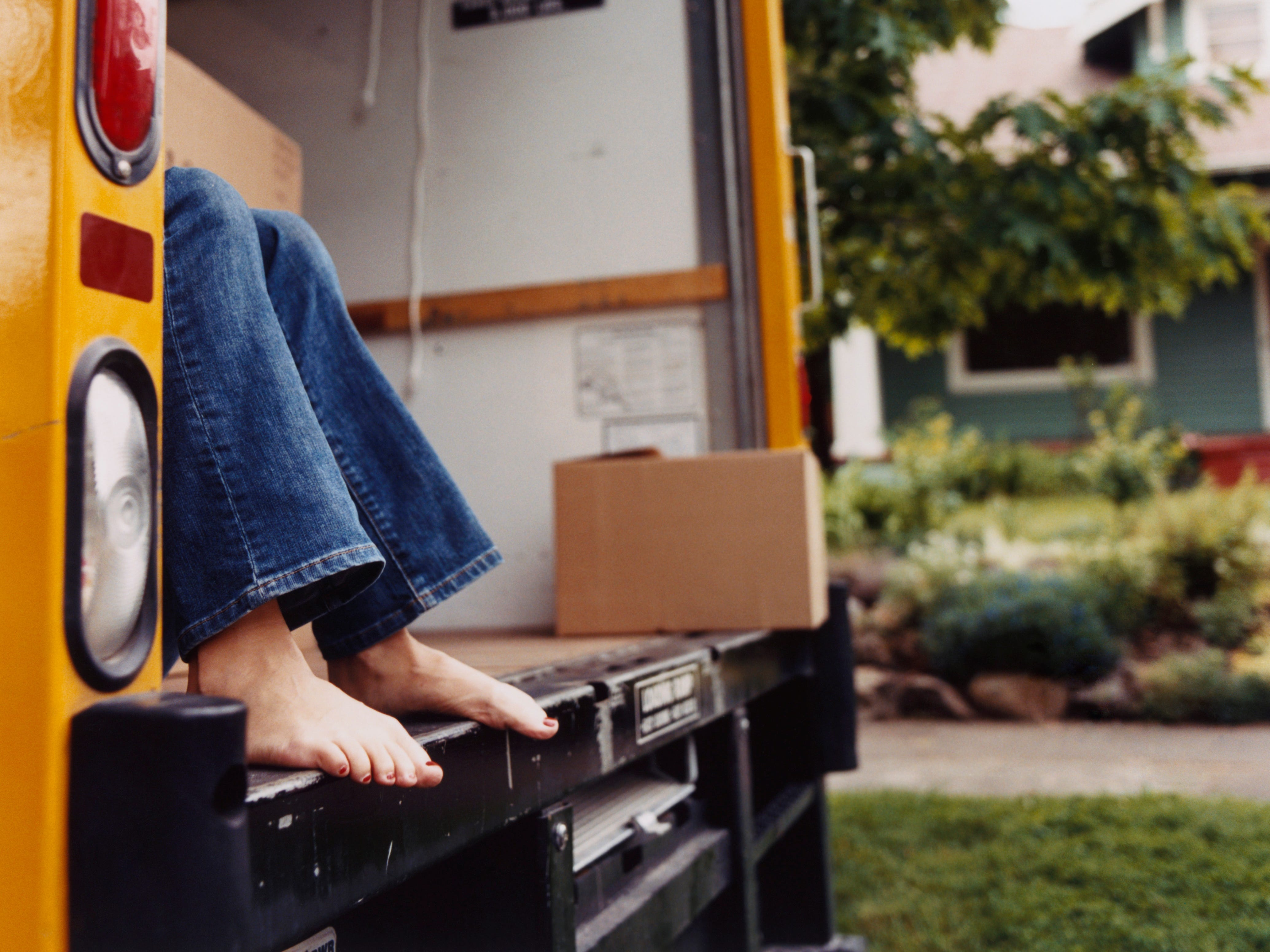 A woman's feet in a moving van.
