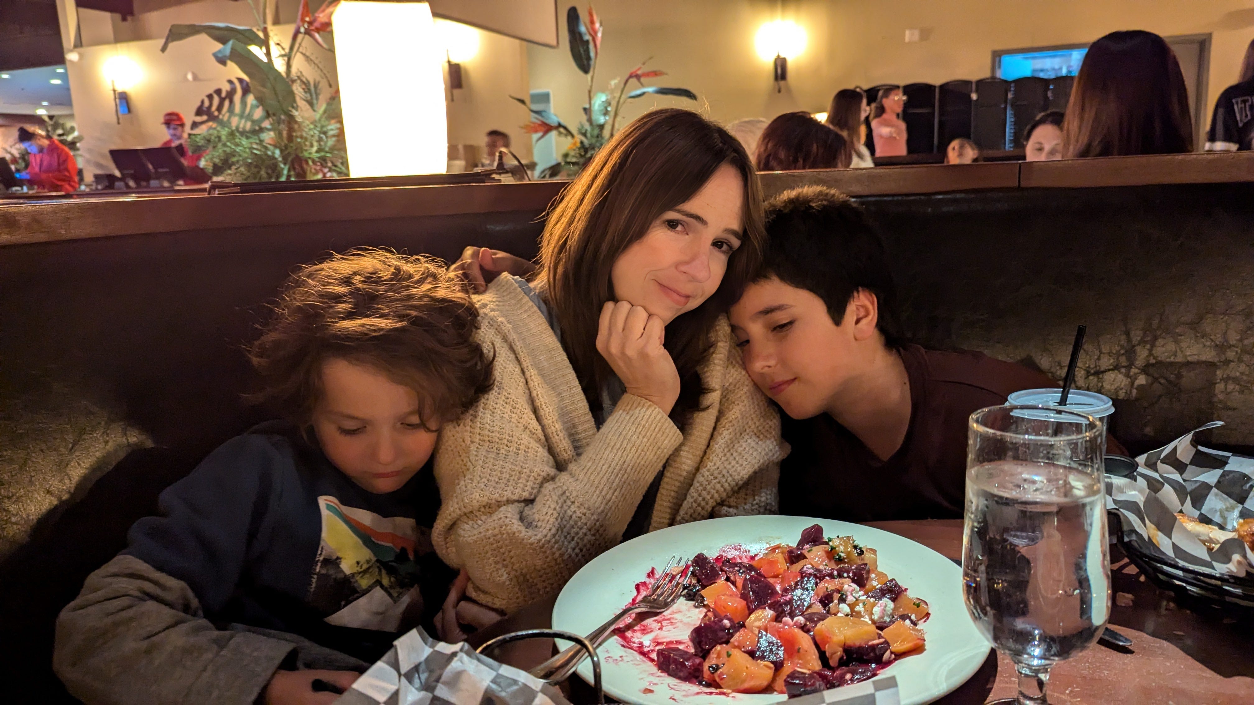 Mom posing with kids at dinner