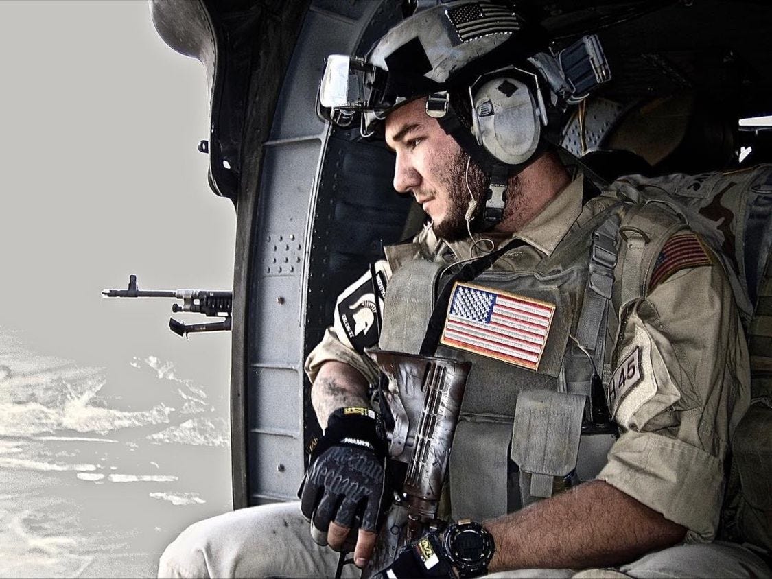 Shawn Ryan in a helicopter in military attire