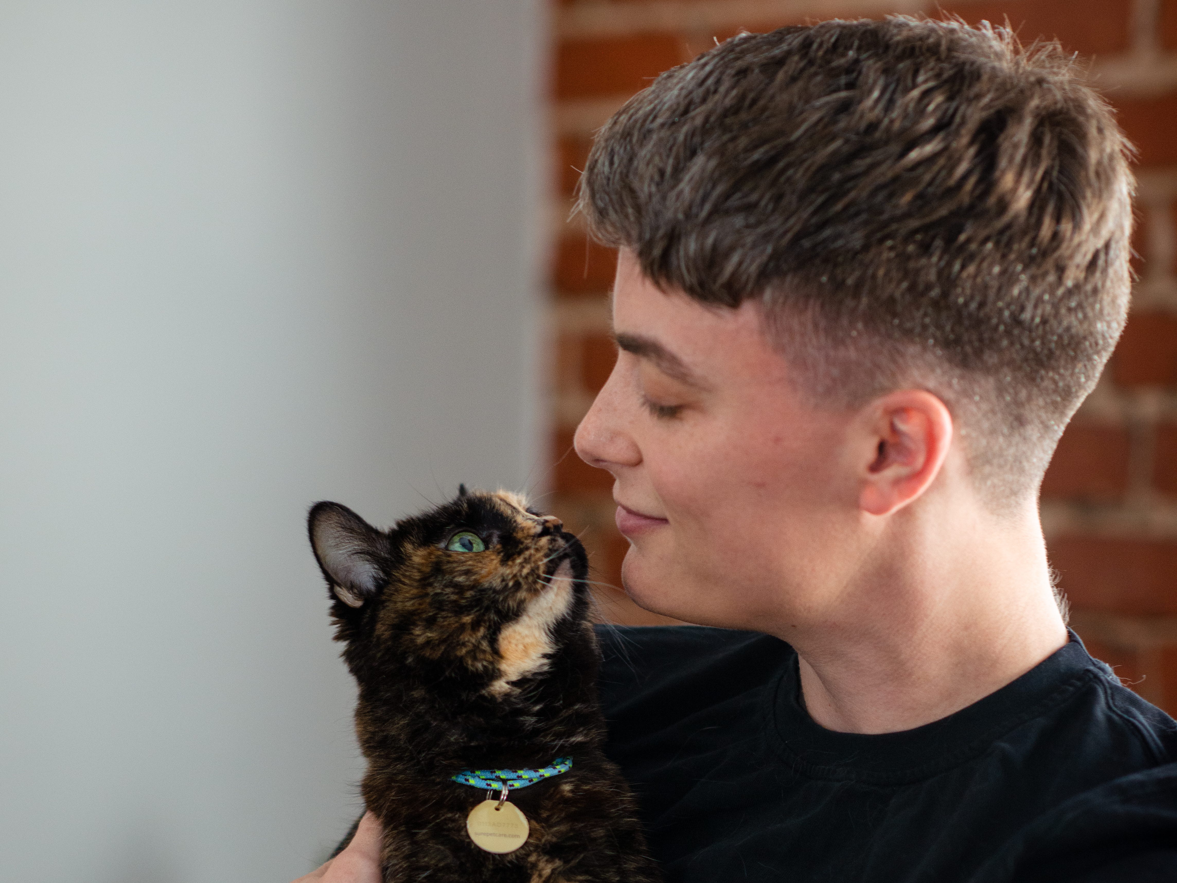 August Odenbaugh holding a cat.