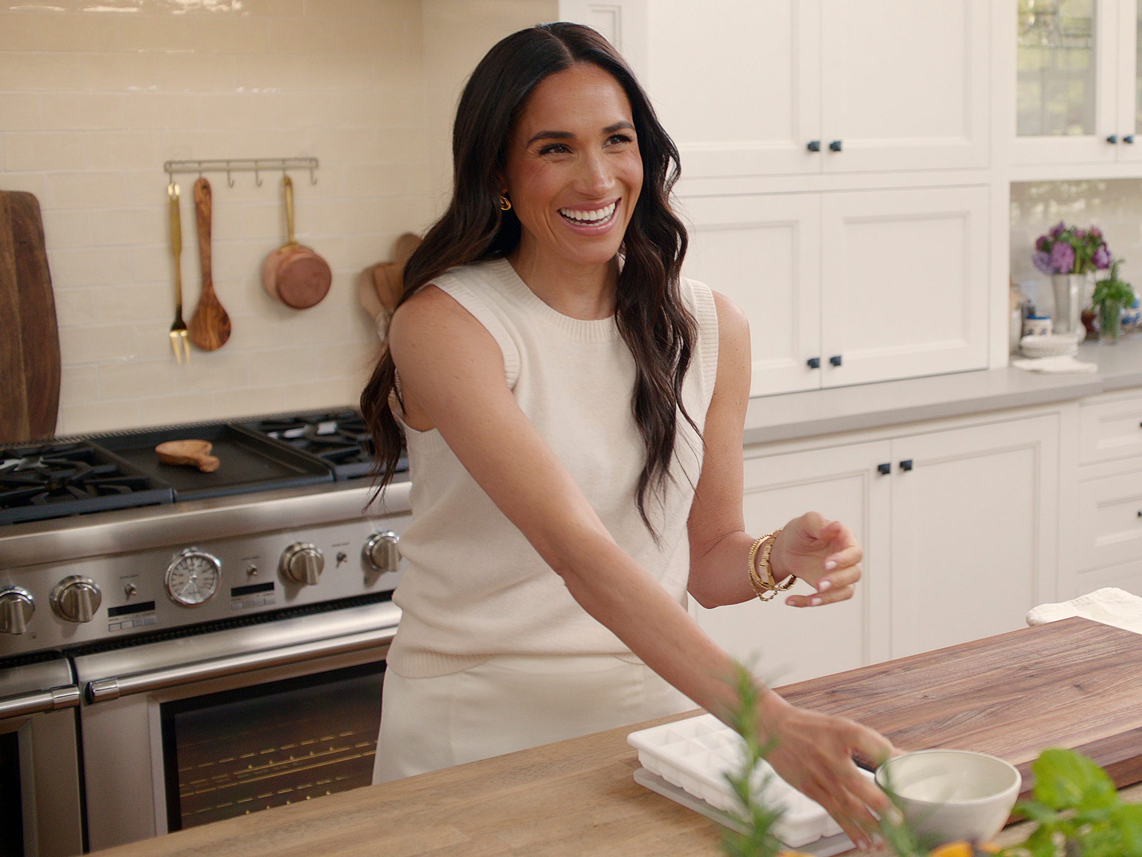 A photo of Meghan Markle in a kitchen.