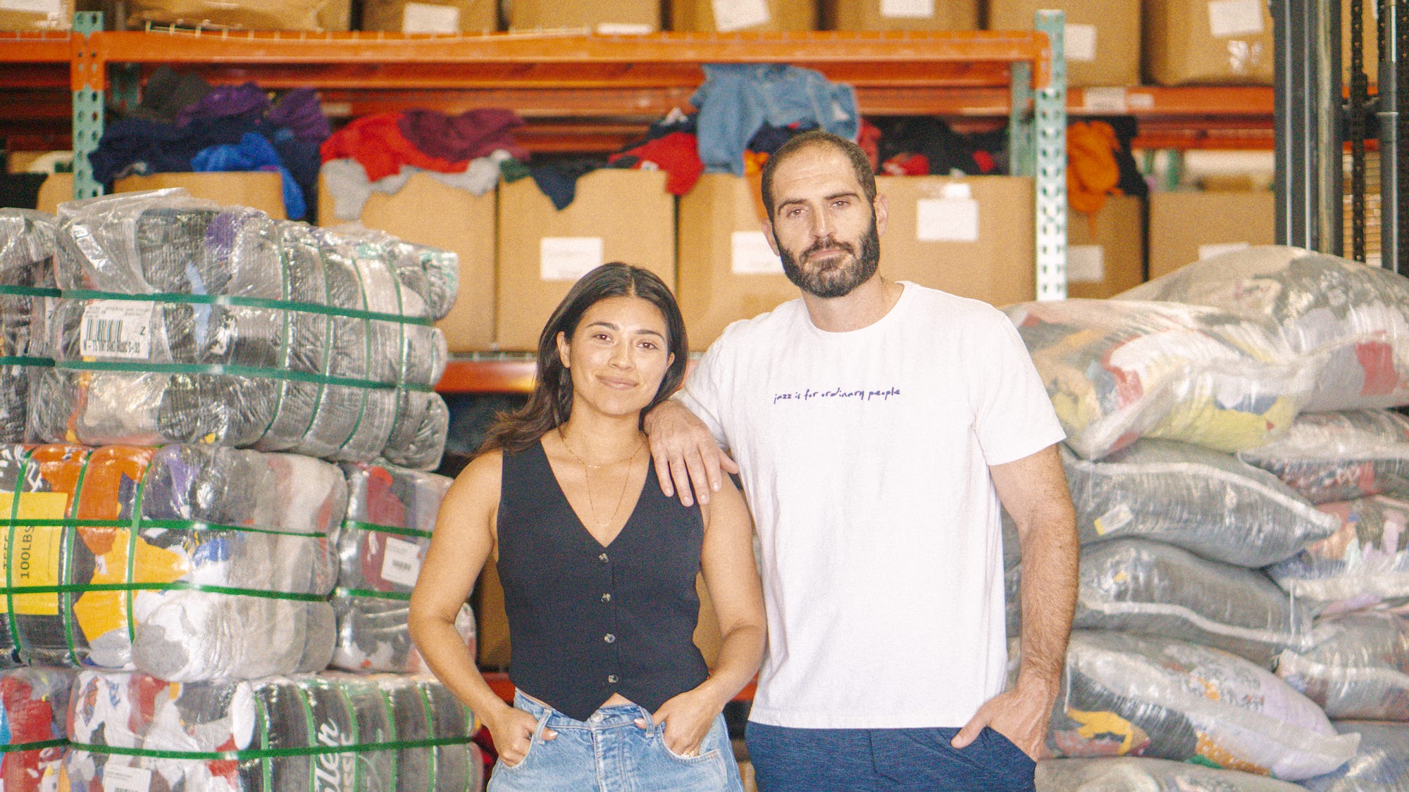Ryan and Evelyn Frankel standing in the Thrift Vintage Fashion warehouse.