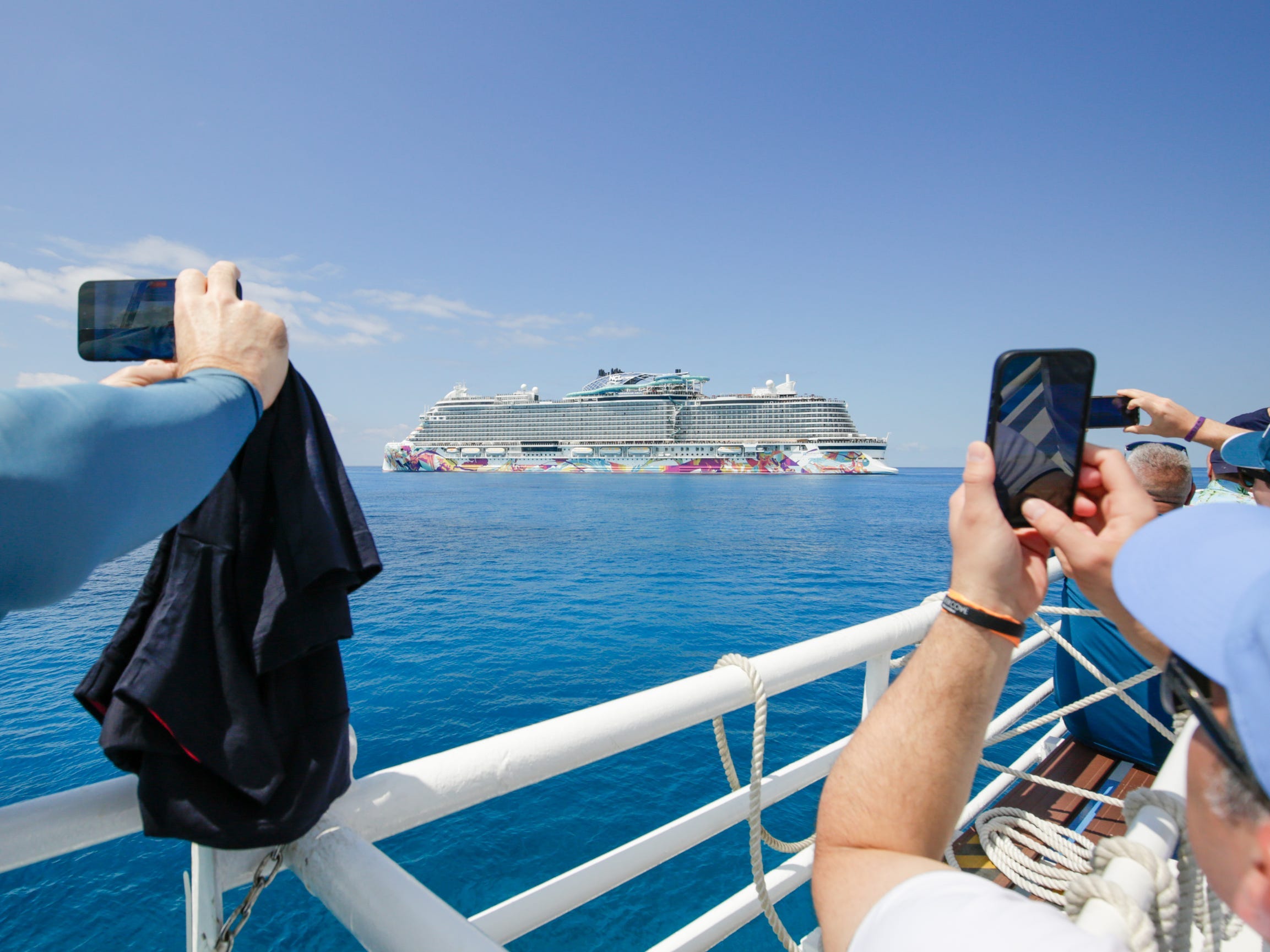people taking photos of Norwegian Aqua