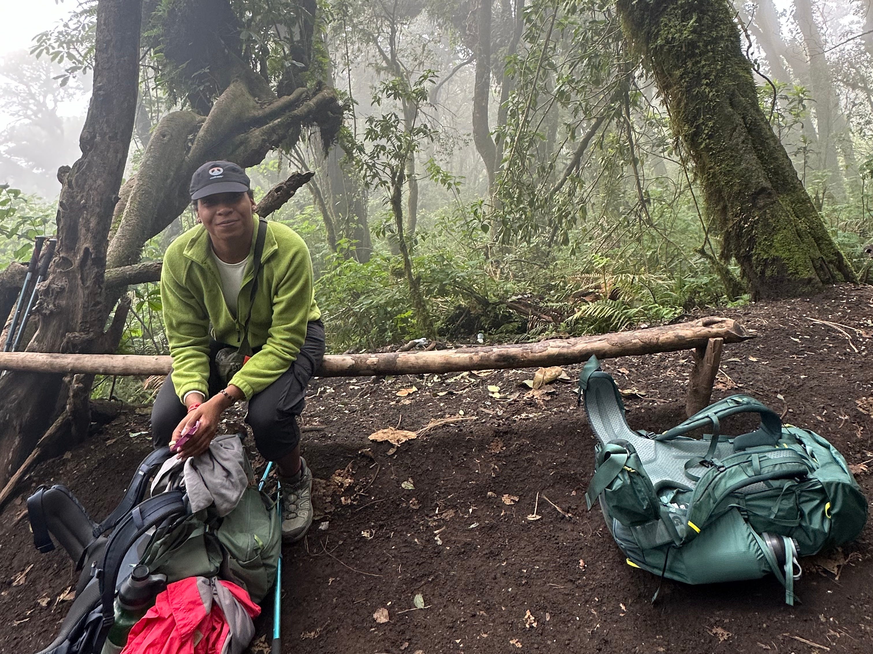 Photo of the author sitting on a bench during a hike up Acatenango in Guatemala.