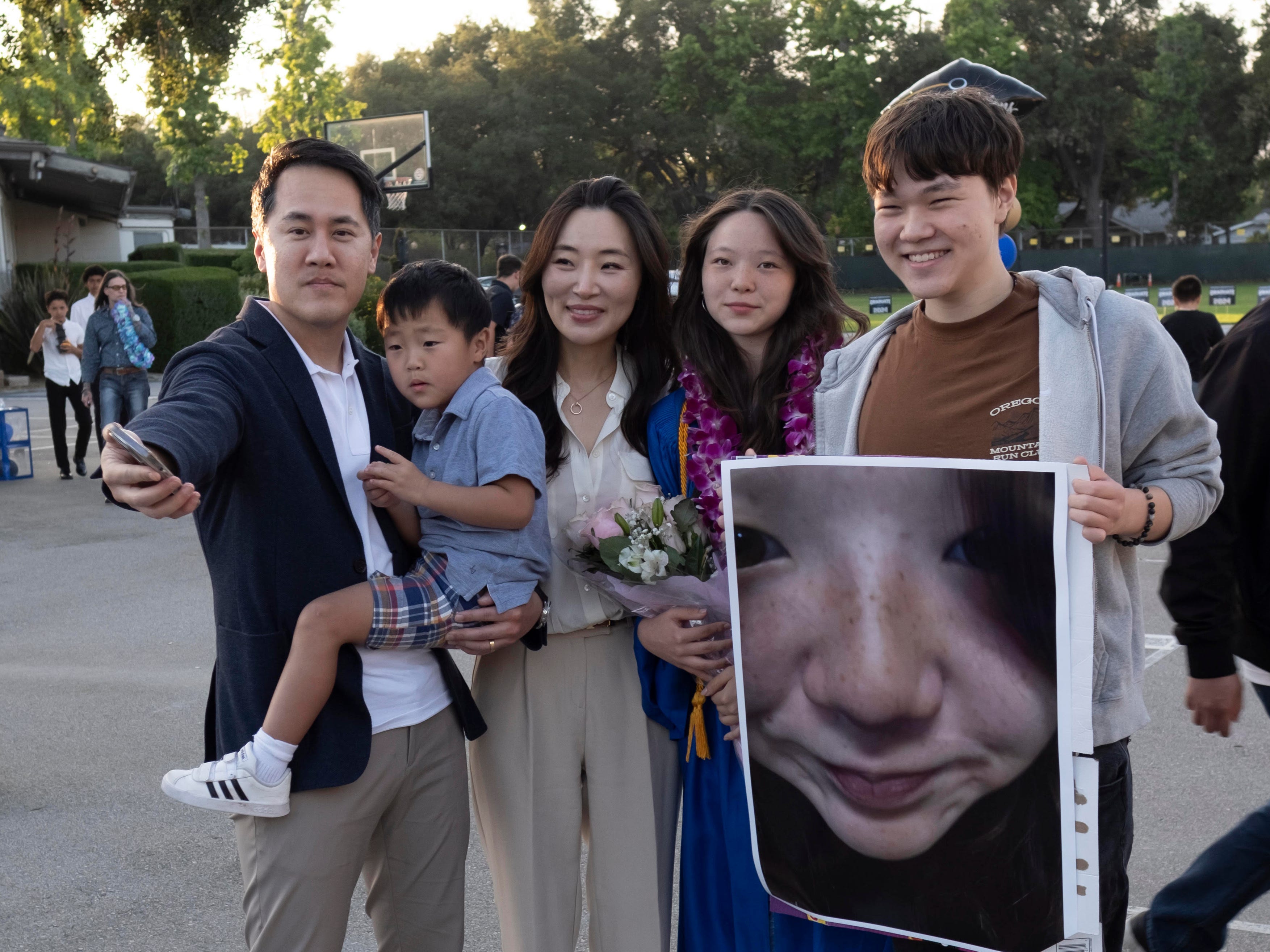 a family of 5 poses for a photo