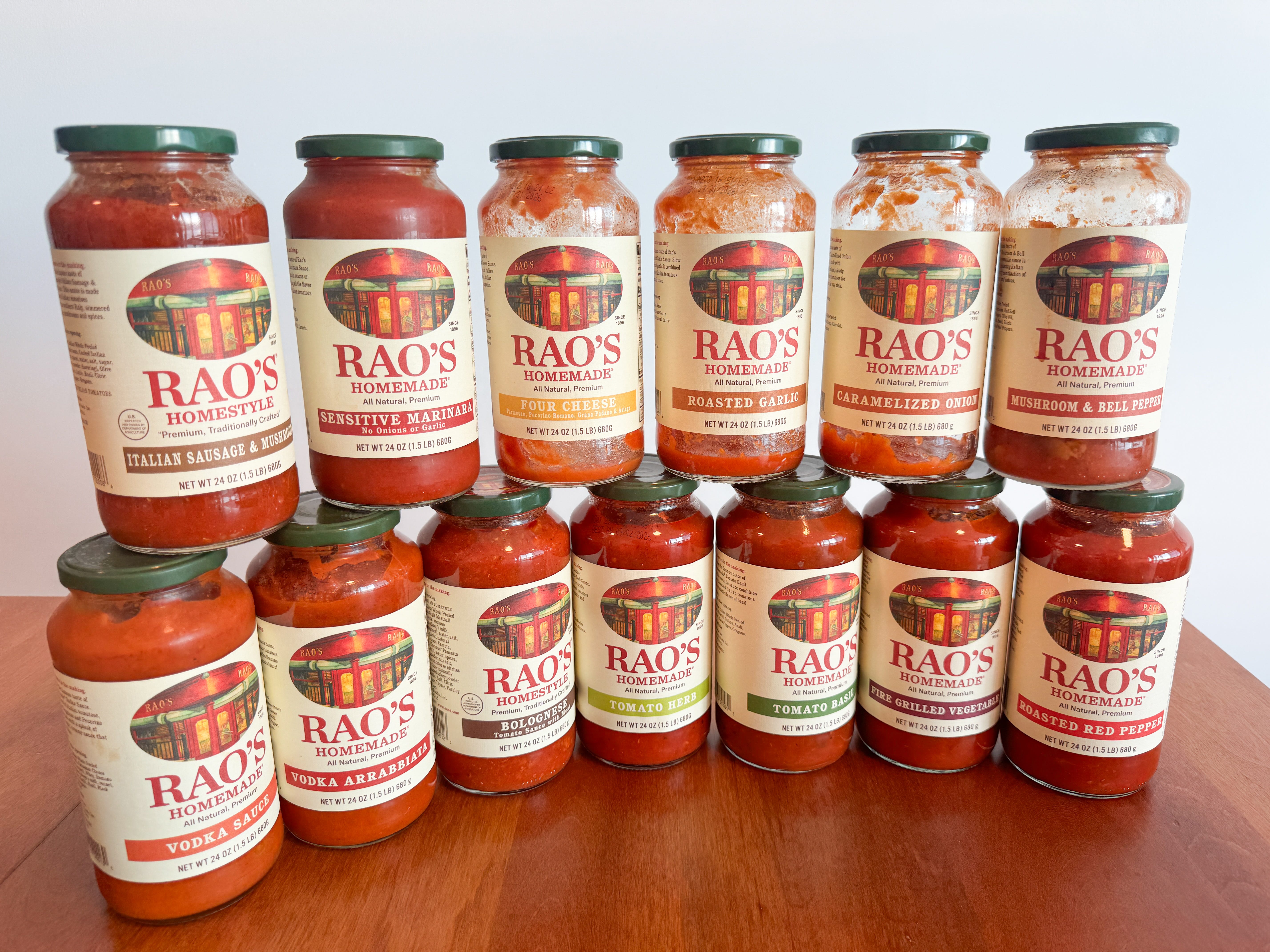 Two rows of Rao's Homemade tomato sauce stacked on top of each other: six on top and seven on the bottom.
