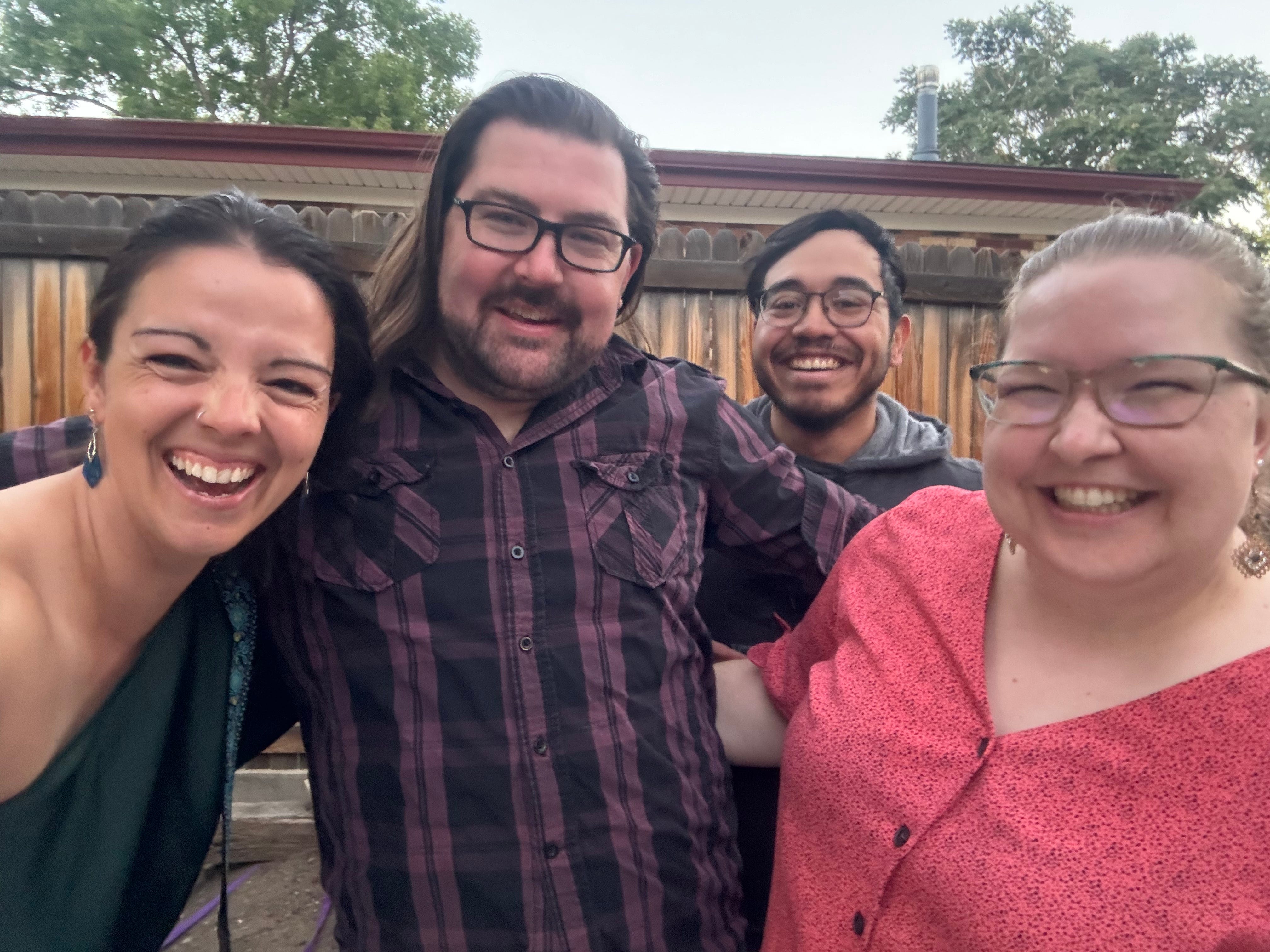 The author with three of her roommates in the backyard of their house.