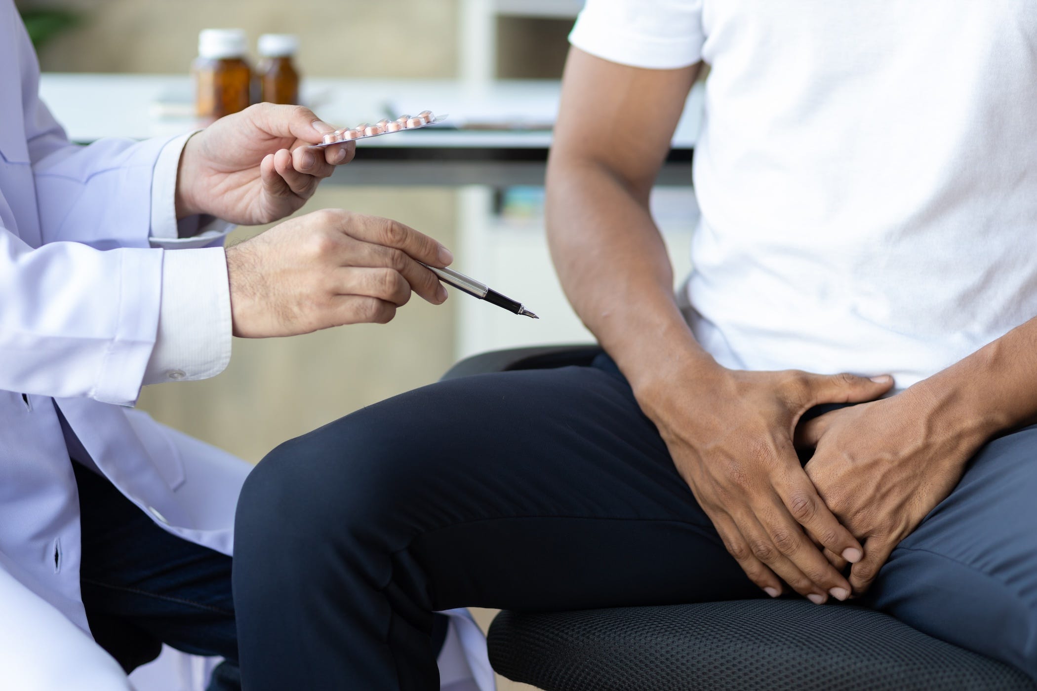 man getting exam at doctor