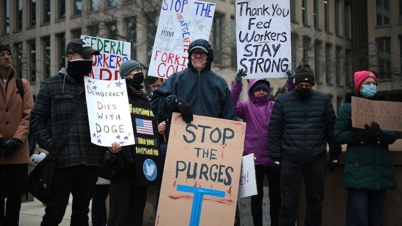 Protesters rally outside of the headquarters of the Office of Personnel Management on February 05, 2025 in Washington, DC.