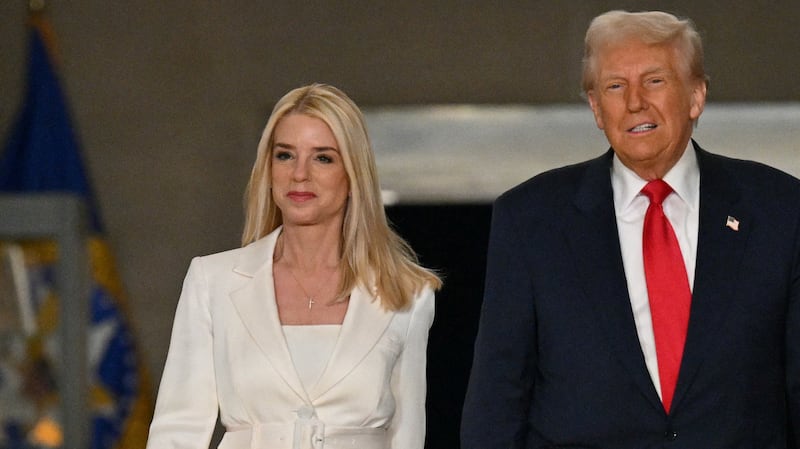 President Donald Trump and Attorney General Pam Bondi arrive to speak at the Department of Justice in Washington, DC, on March 14, 2025. (Photo by ROBERTO SCHMIDT / AFP) (Photo by ROBERTO SCHMIDT/AFP via Getty Images)