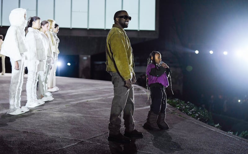 Kanye West and North West on the catwalk (Photo by WWD/Penske Media via Getty Images)