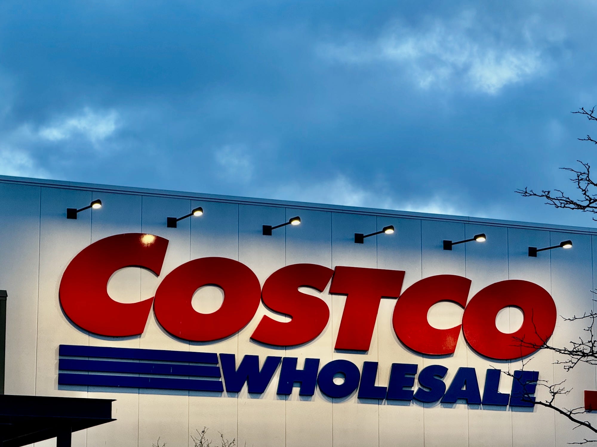 A Costco warehouse seen at dusk.