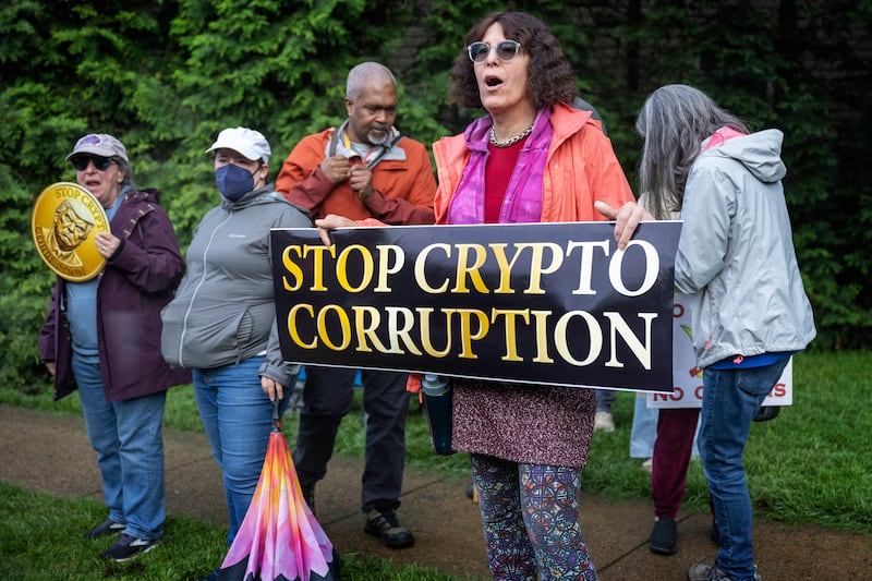 Demonstrators shout outside Trump National Golf Course in Sterling, Virginia, on May 22, 2025.